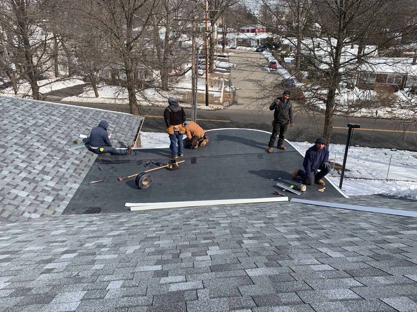 Commercial Roofing Installation using EPDM with white gutters by A Plus Exterior