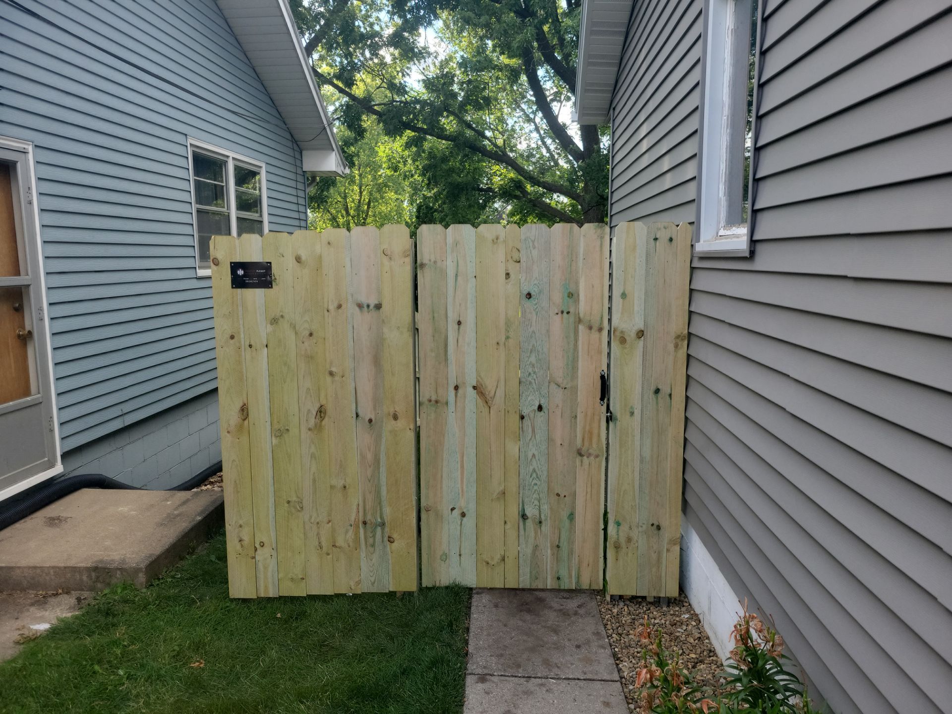 Pressure-Treated Pine Privacy Fence and Custom Gates in Waterloo by Perfect Picket Fence and Stain
