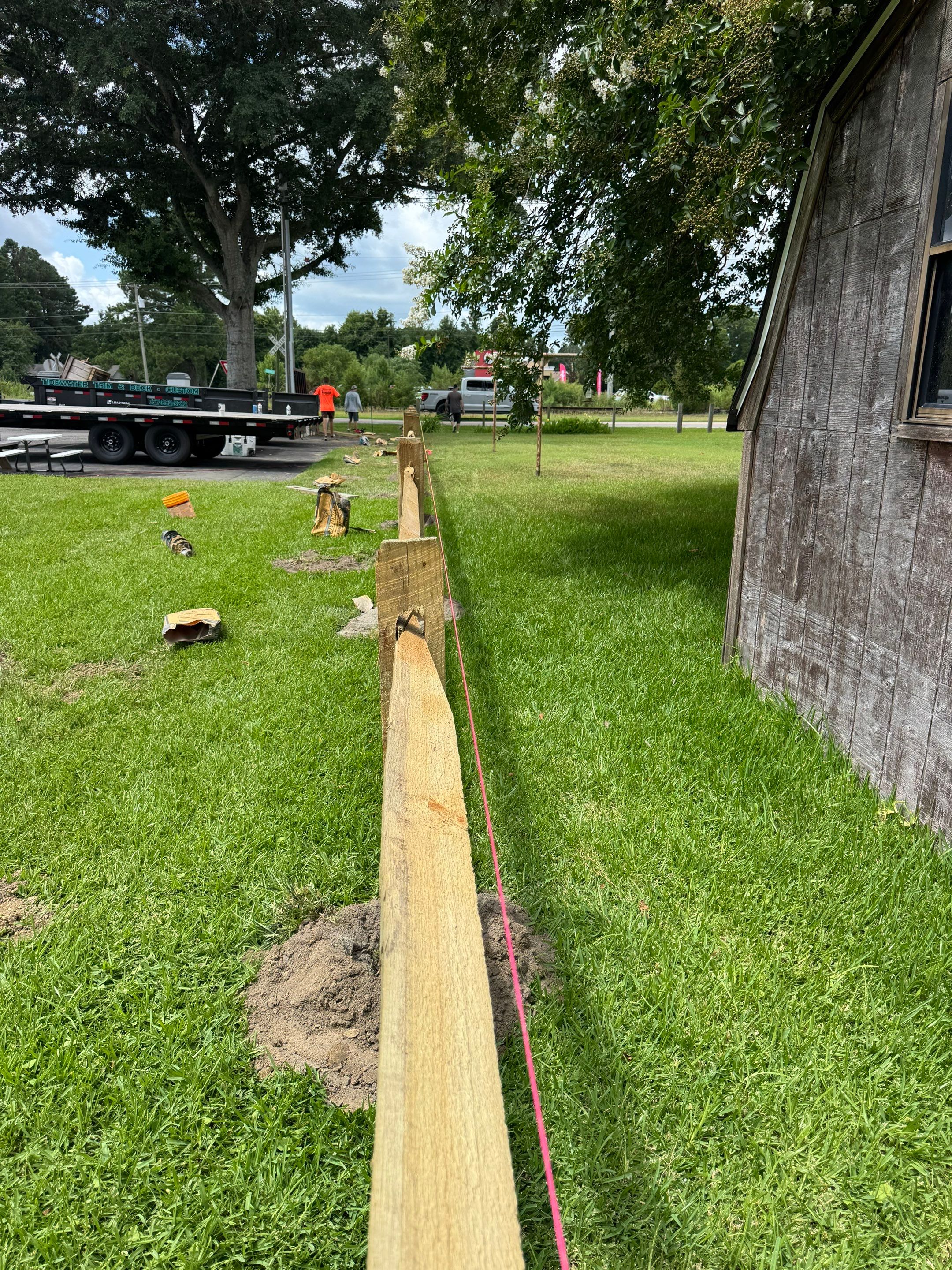 The Fence That Welcomes You Home by Tidewater Trim & Deck