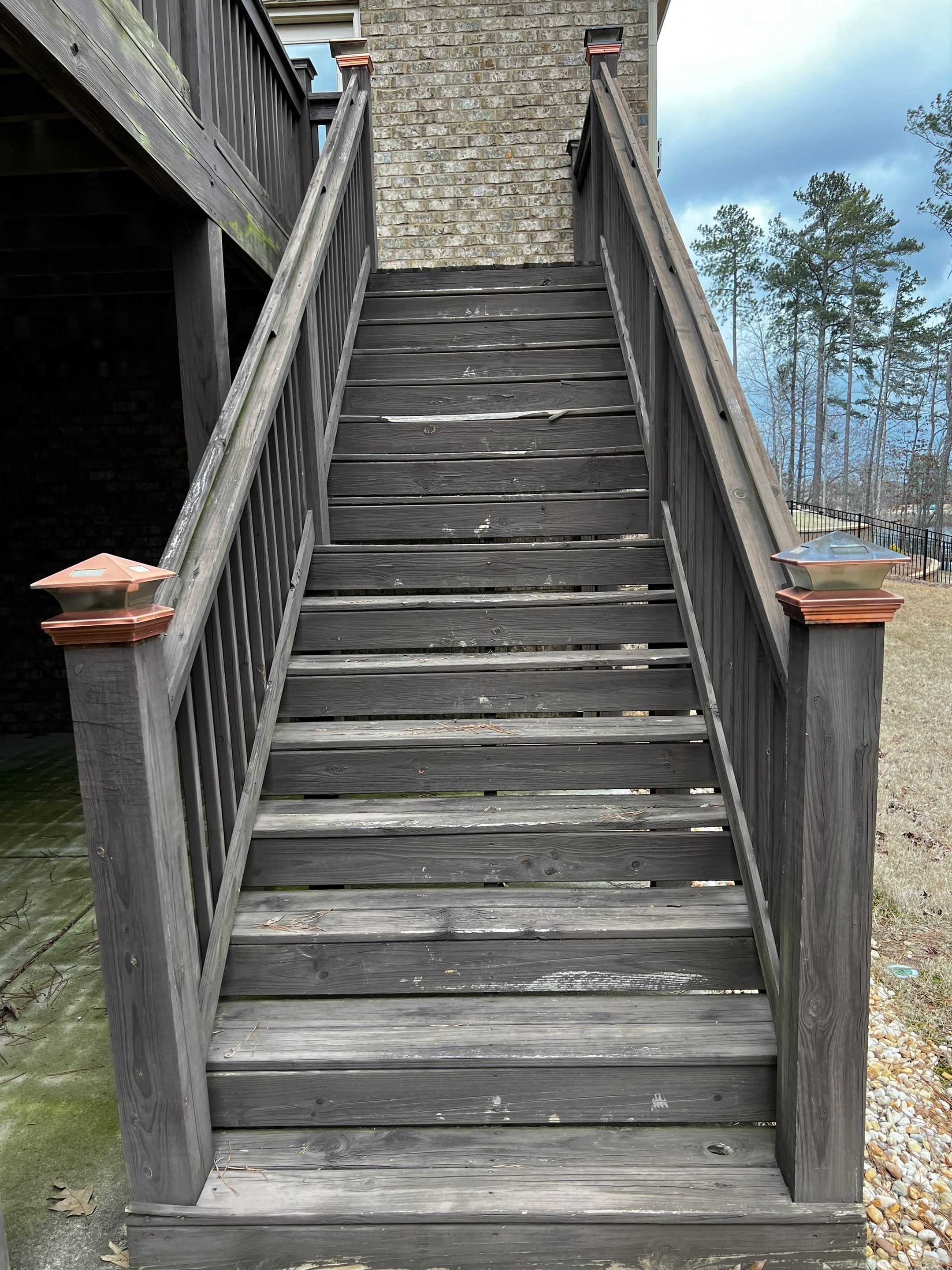 Elevated Pressure-Treated Wood Deck and Staircase in Hampton by Swift Home Renovations