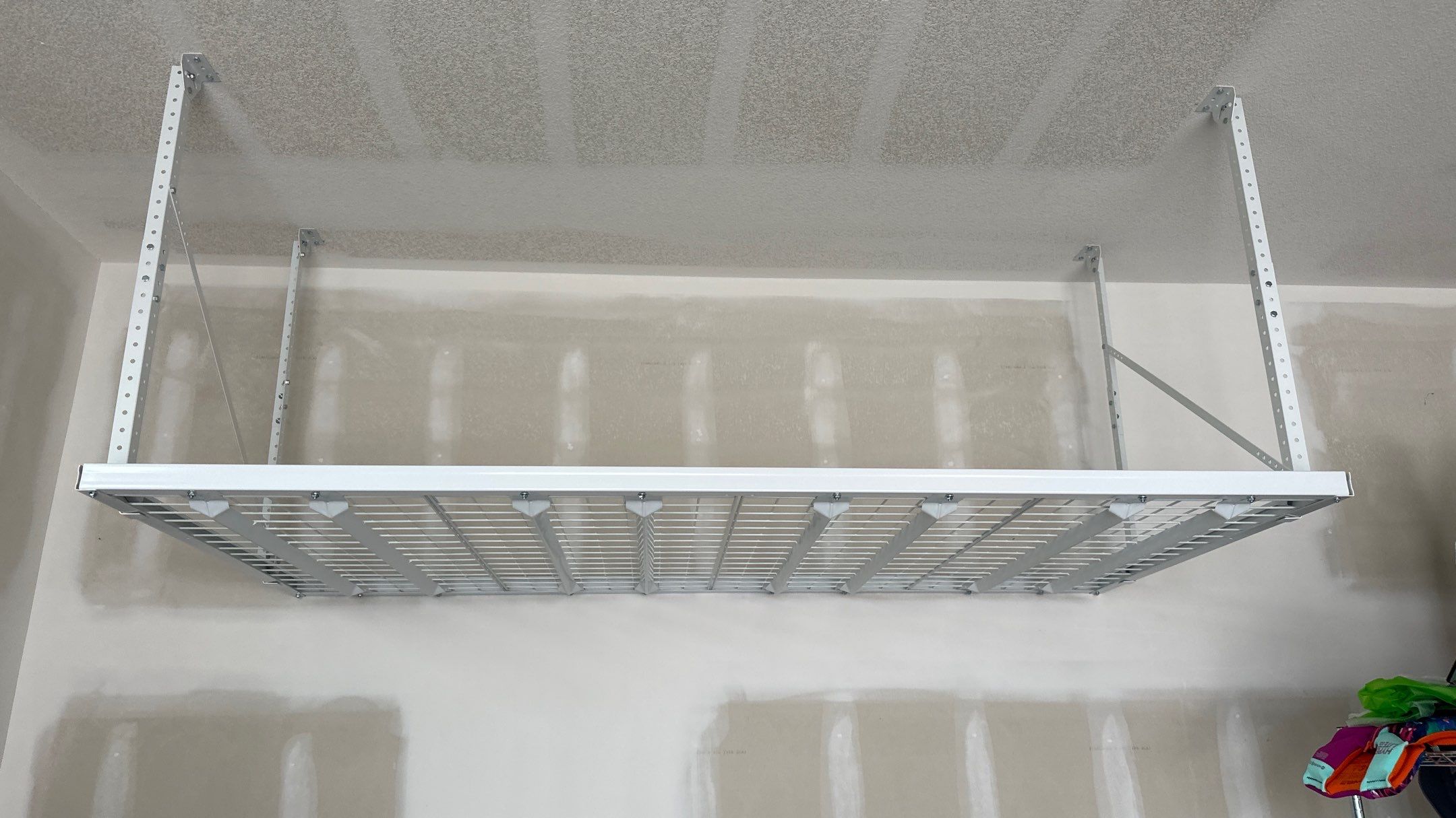 Kris K. upgraded their garage with overhead racks by Banner Garage