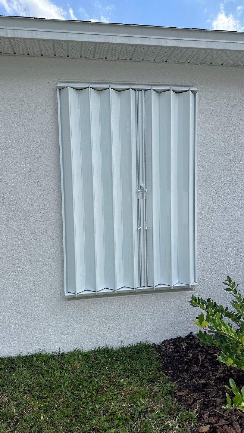 Accordion Shutters in White by Smart Guard Shutters