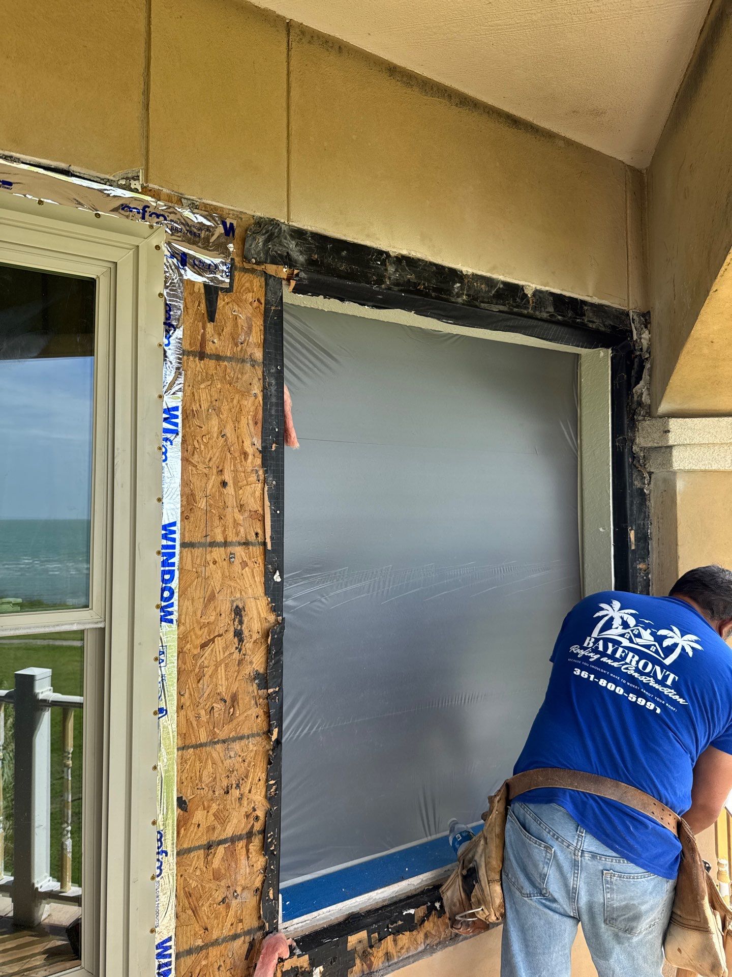 Installing Windows on a Submarine  by Bayfront Roofing and Construction