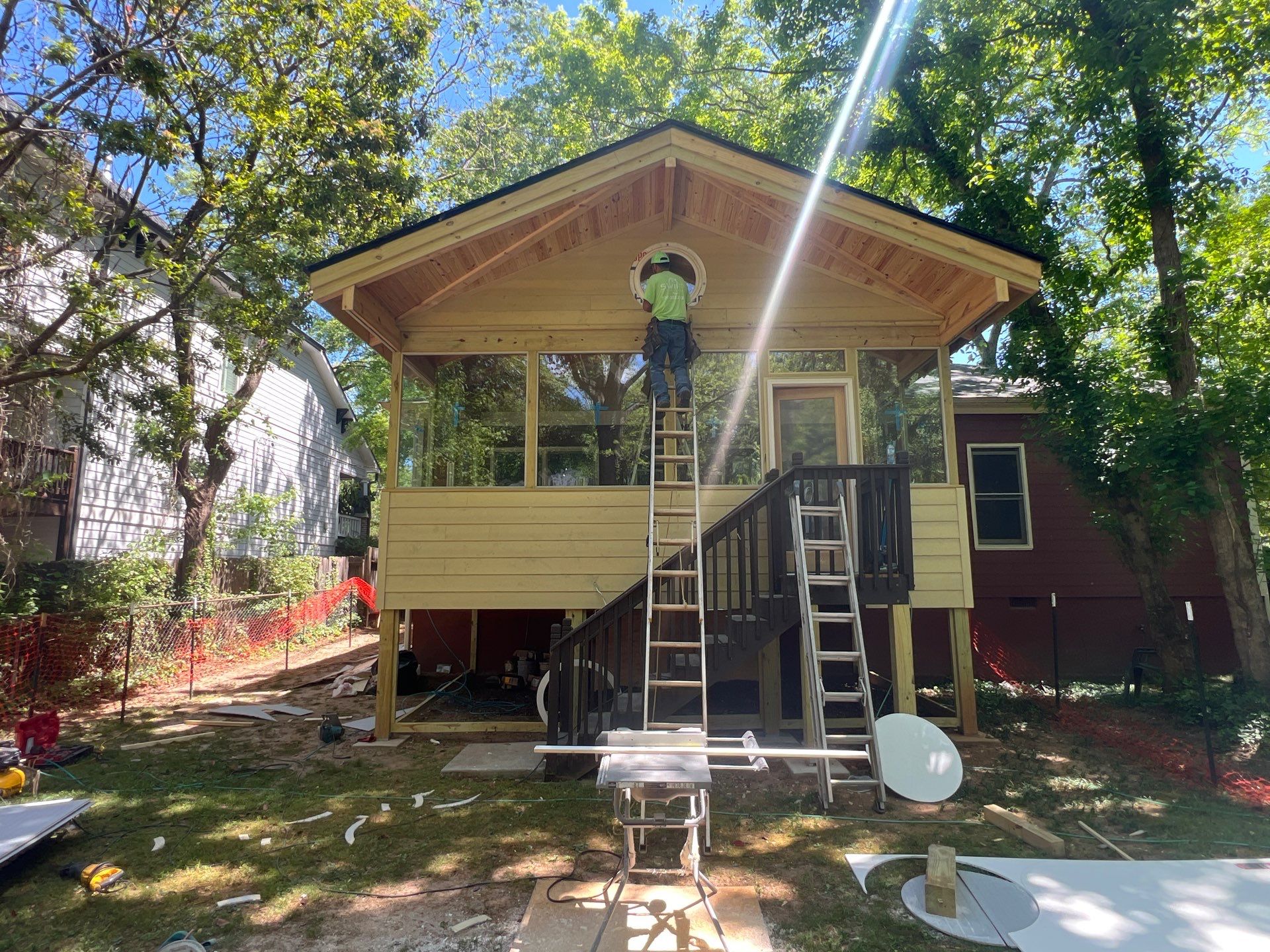 Elevated Screened-In Porch Addition with Vaulted Tongue-and-Groove Ceiling by Swift Home Renovations