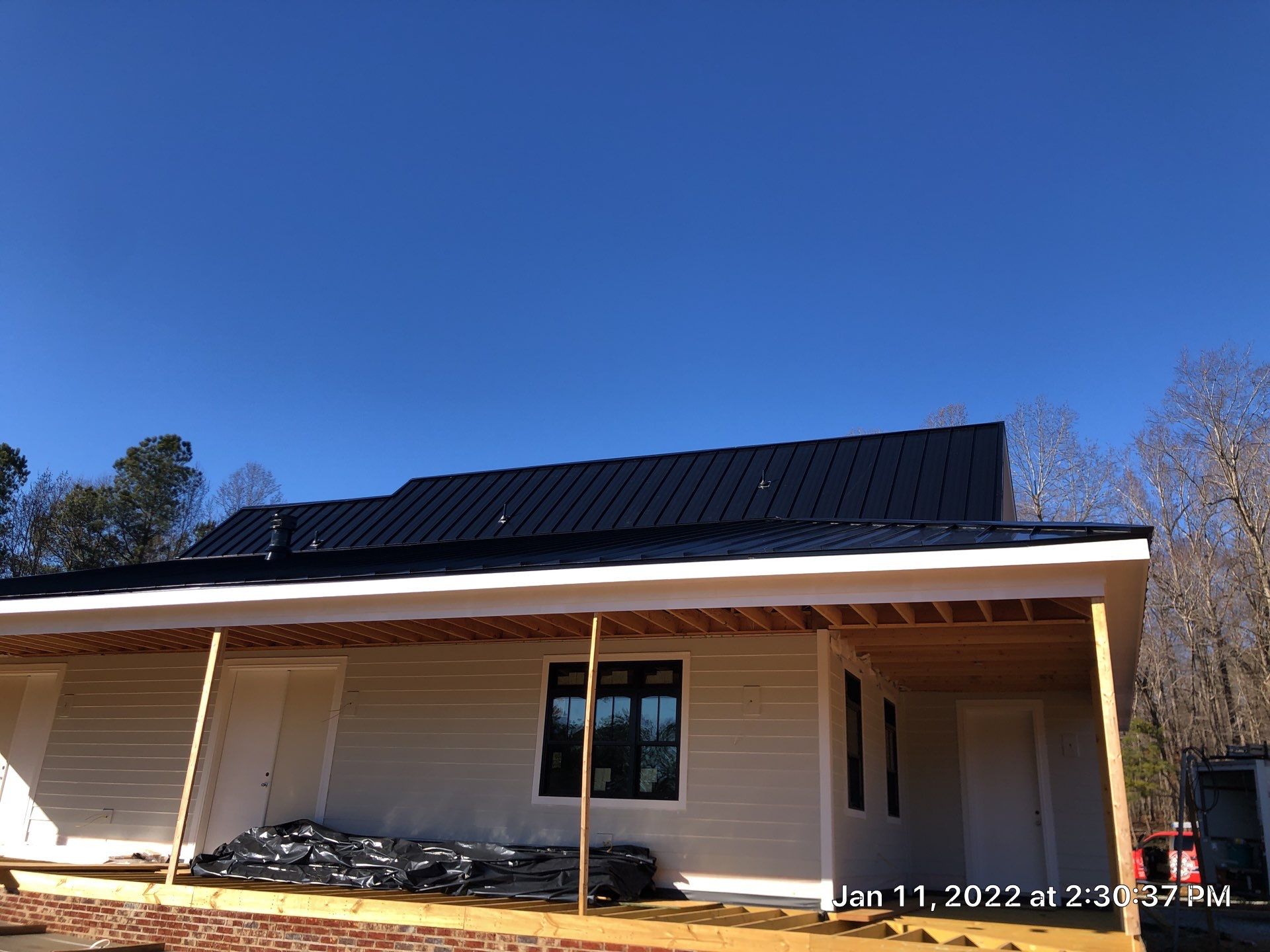 Custom Home Metal Roof Installation by Just In Time Roofing and Restoration
