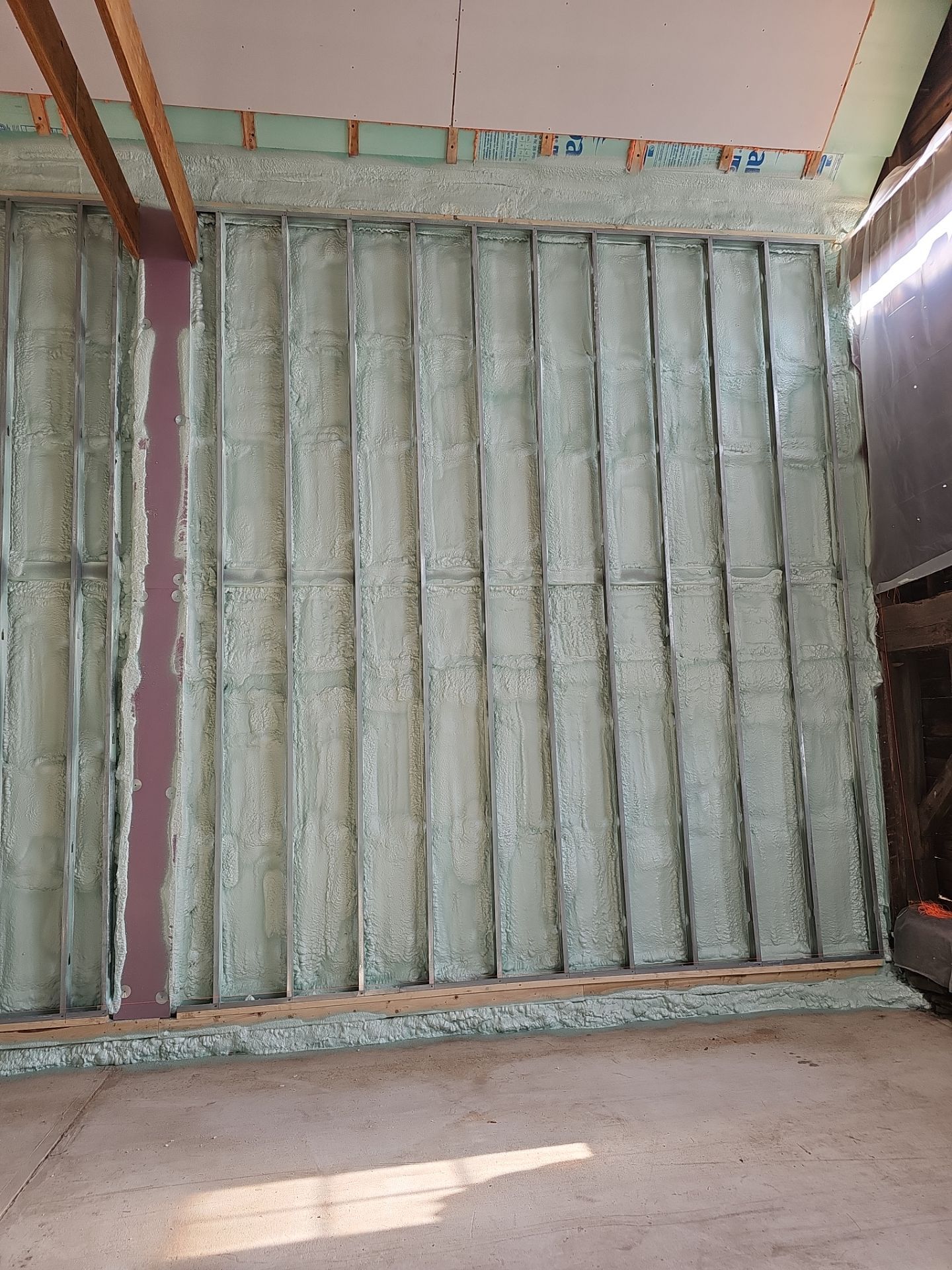 Exterior Installation using Closed Cell Spray Foam by NYS Foam & Energy