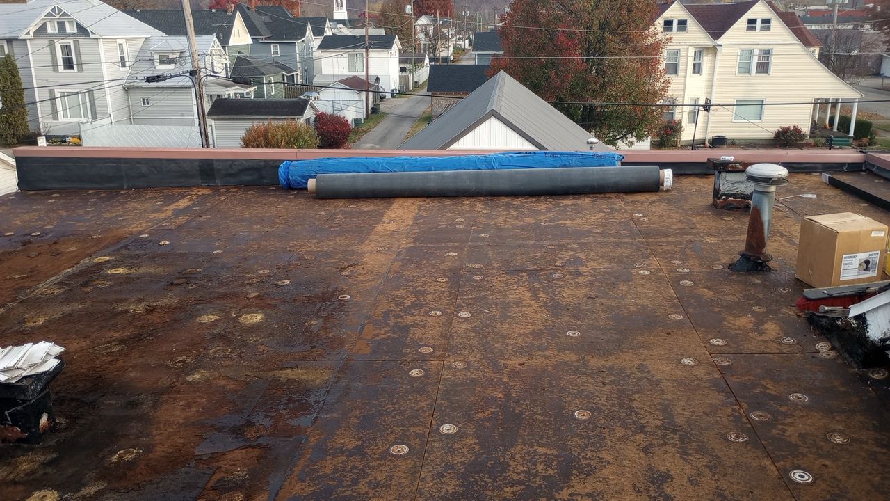 Commercial Roofing Installation using Performance Shingles by Mr. Roofer