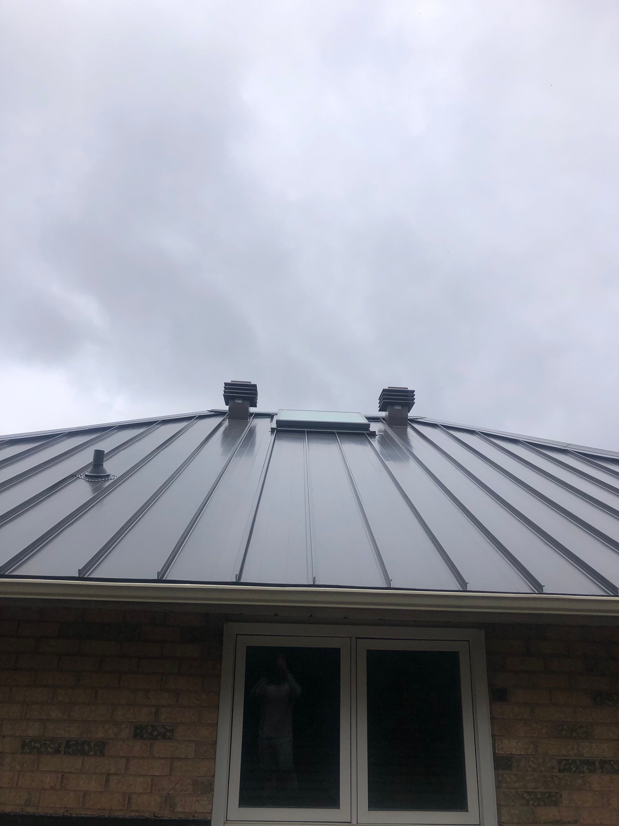 Residential Roofing Installation using 16" Standing Seam Panels by Jay Carter Roofing & Sheet Metal