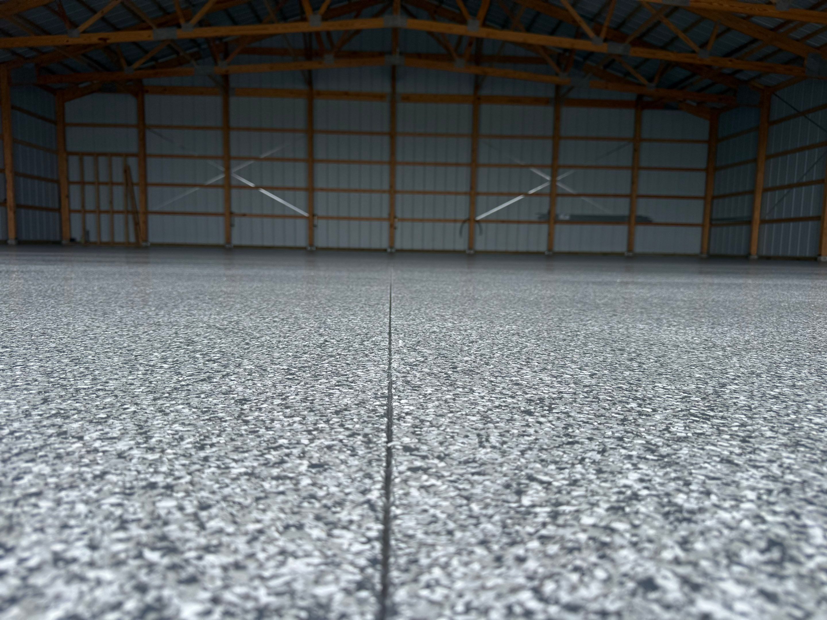Durable Grey Speckled Epoxy Floor Coating for Yankton Shop by Select Painting, Coatings & Garage Cabinets
