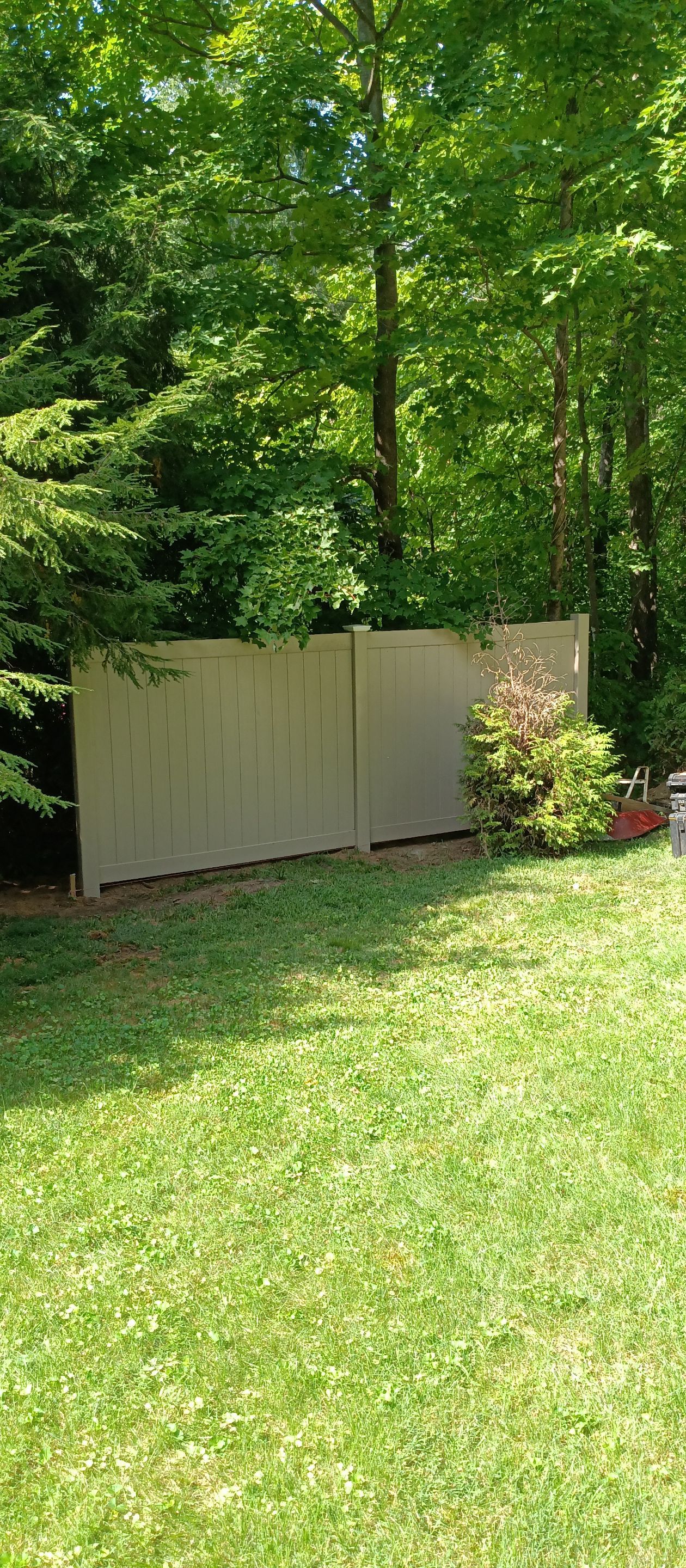 New Vinyl Privacy fence in Classic Clay by DiGiorgi Roofing and Siding Inc