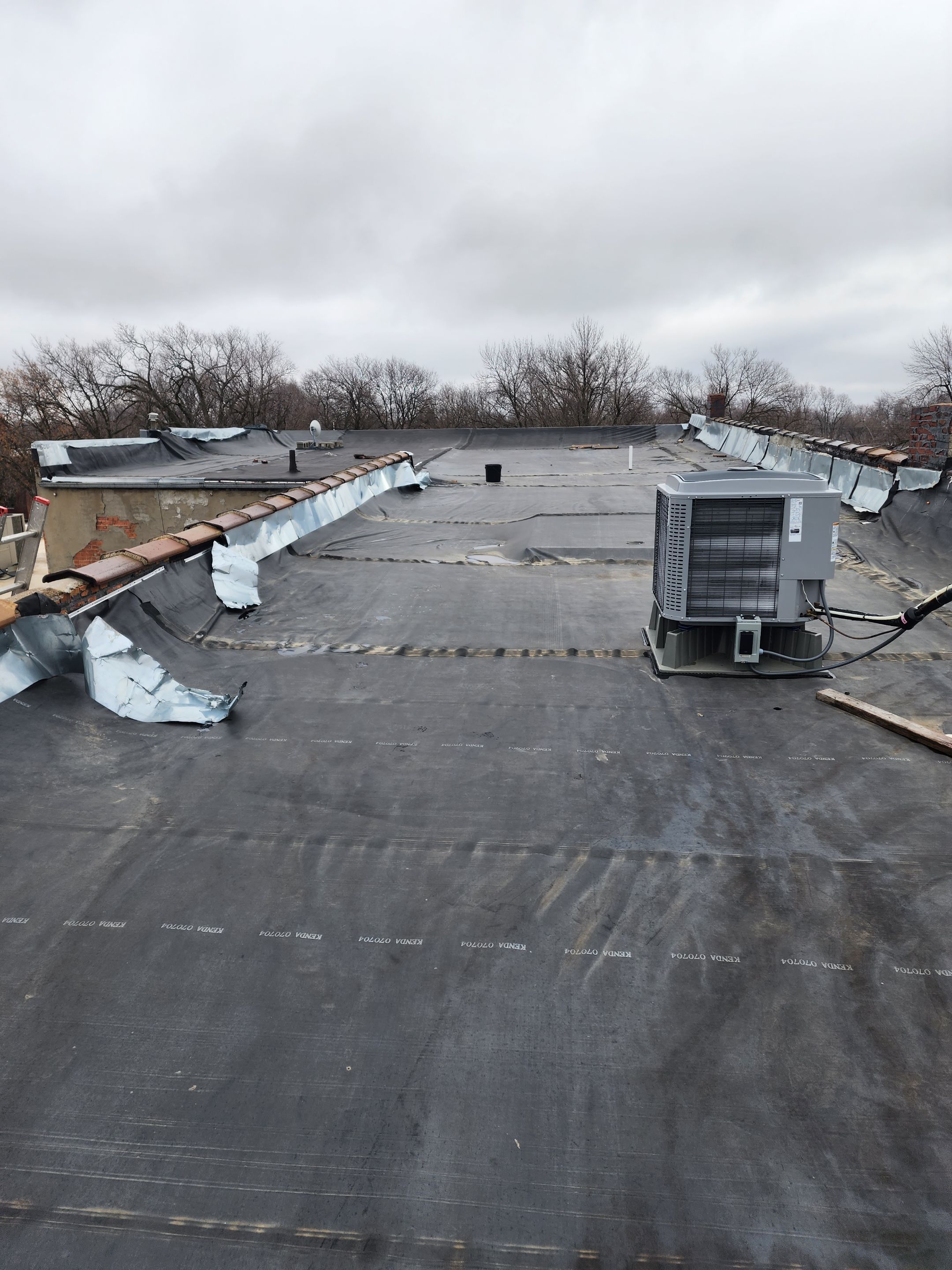 Roof Recover on a downtown building in Lake City  by Grell Roofing