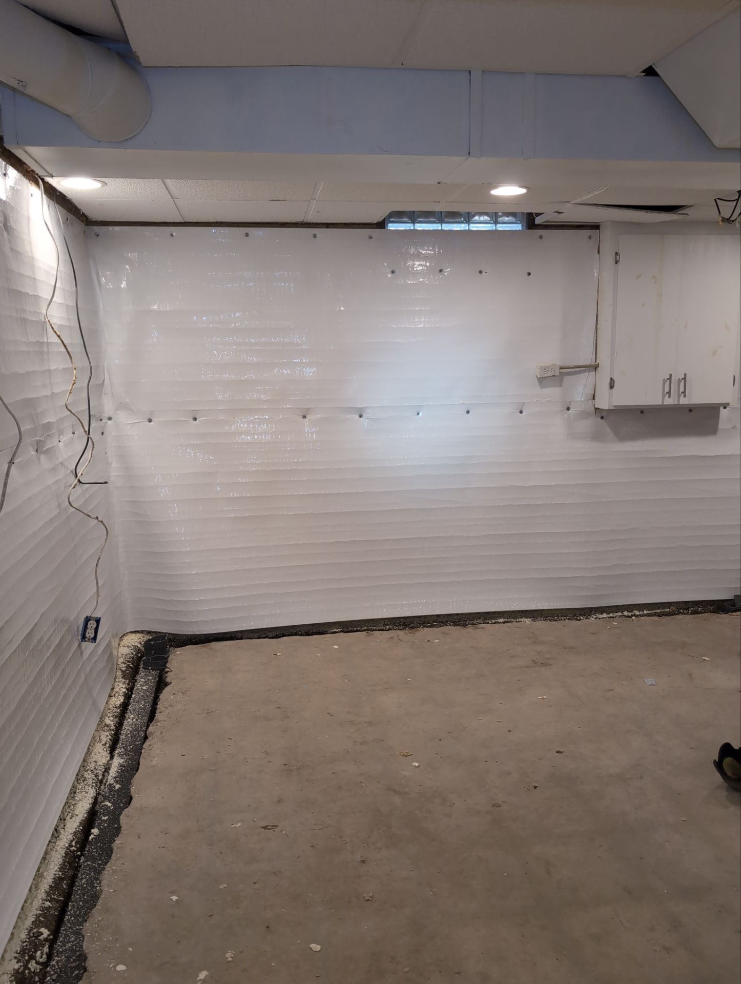 Interior Basement Waterproofing System and Egress Window Installation by Toledo Basement Repair 
