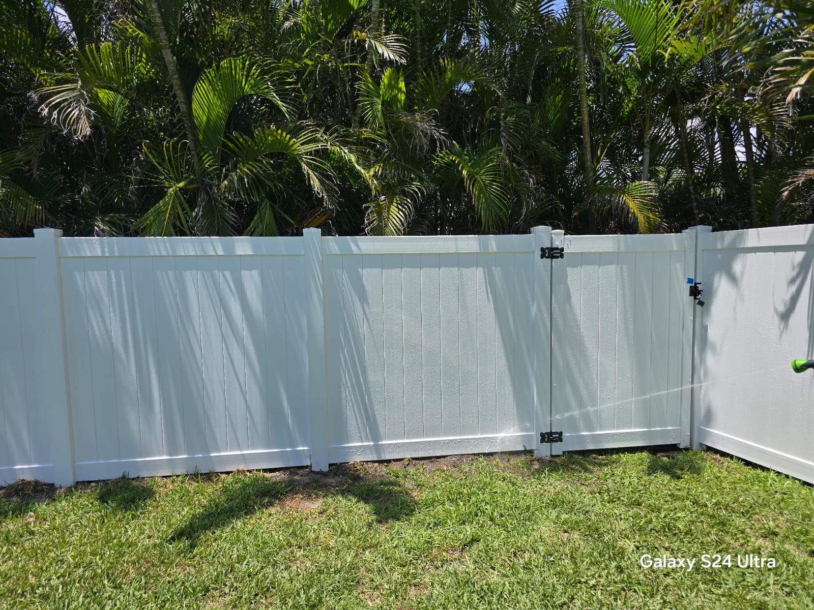 White Vinyl Privacy Fence and Double Gate Installation in Fort Myers by True Fence LLC