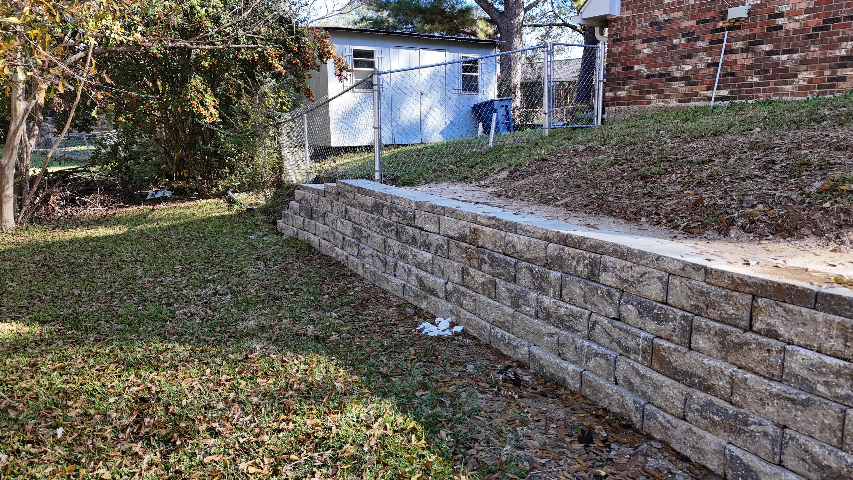 Elegant Stone Retaining Wall by Roberson Construction LLC