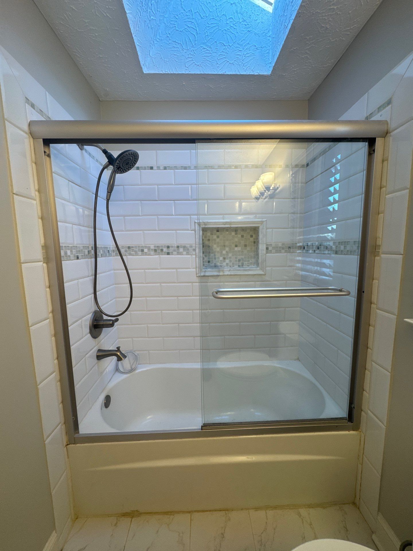 Smyrna Bathroom Remodel Featuring Sage Green Vanity and Hexagonal Tile by Swift Home Renovations