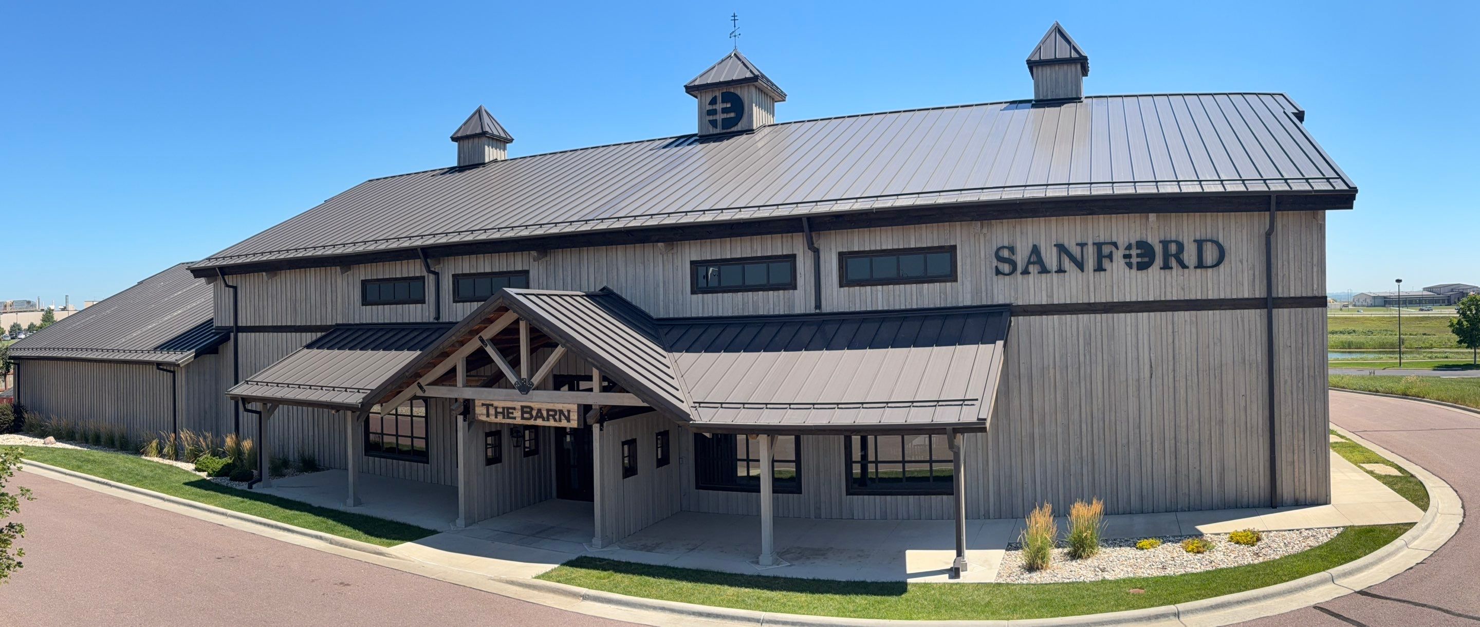 Commercial Exterior Wood Staining for Sanford Barn in Sioux Falls by Select Painting, Coatings & Garage Cabinets