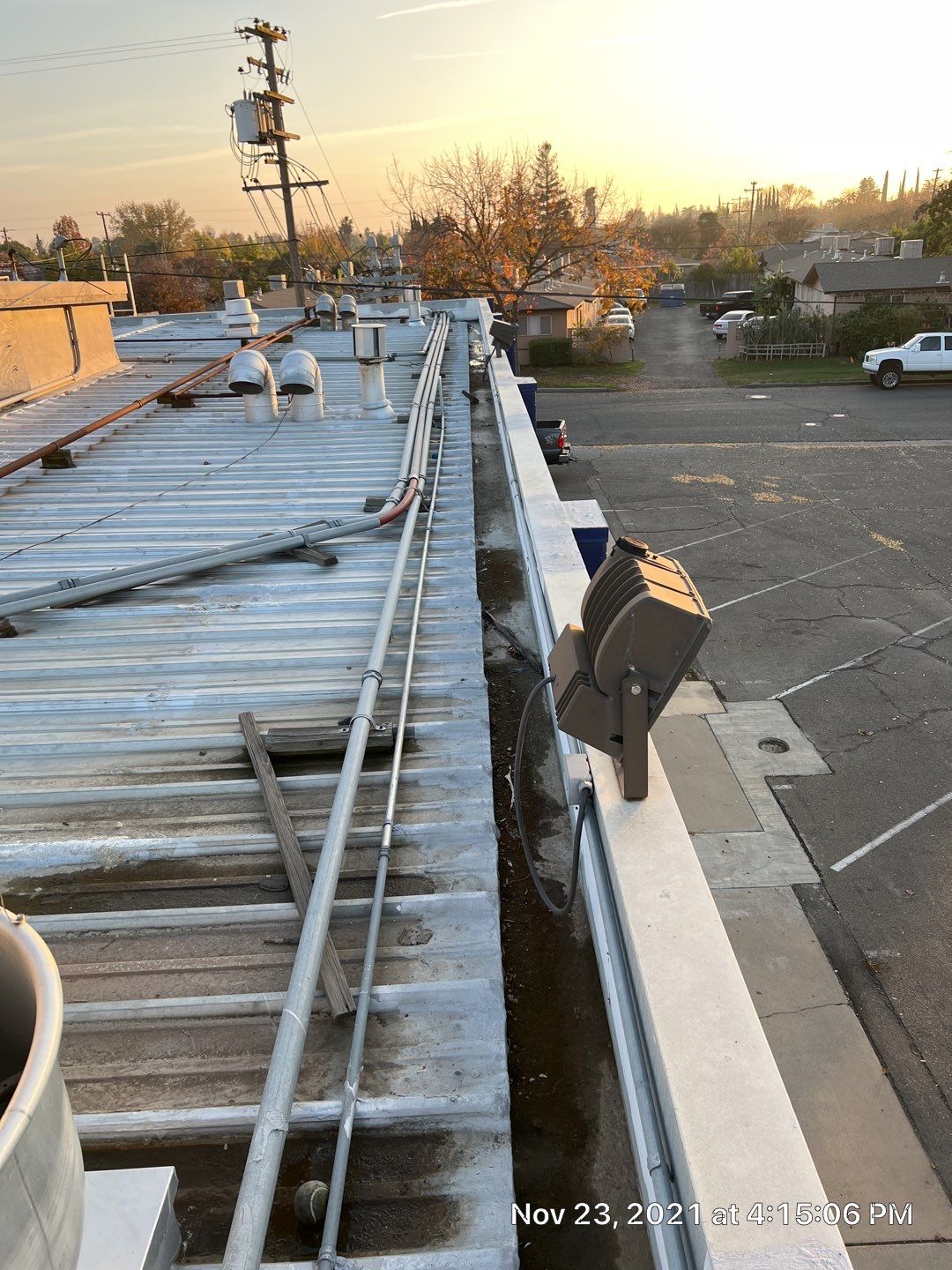 Metal roof restoration on commercial roof using Conklin Benchmark/ PUMA XL acrylic coatings over metal and foam by Straight Edge Roofing Inc