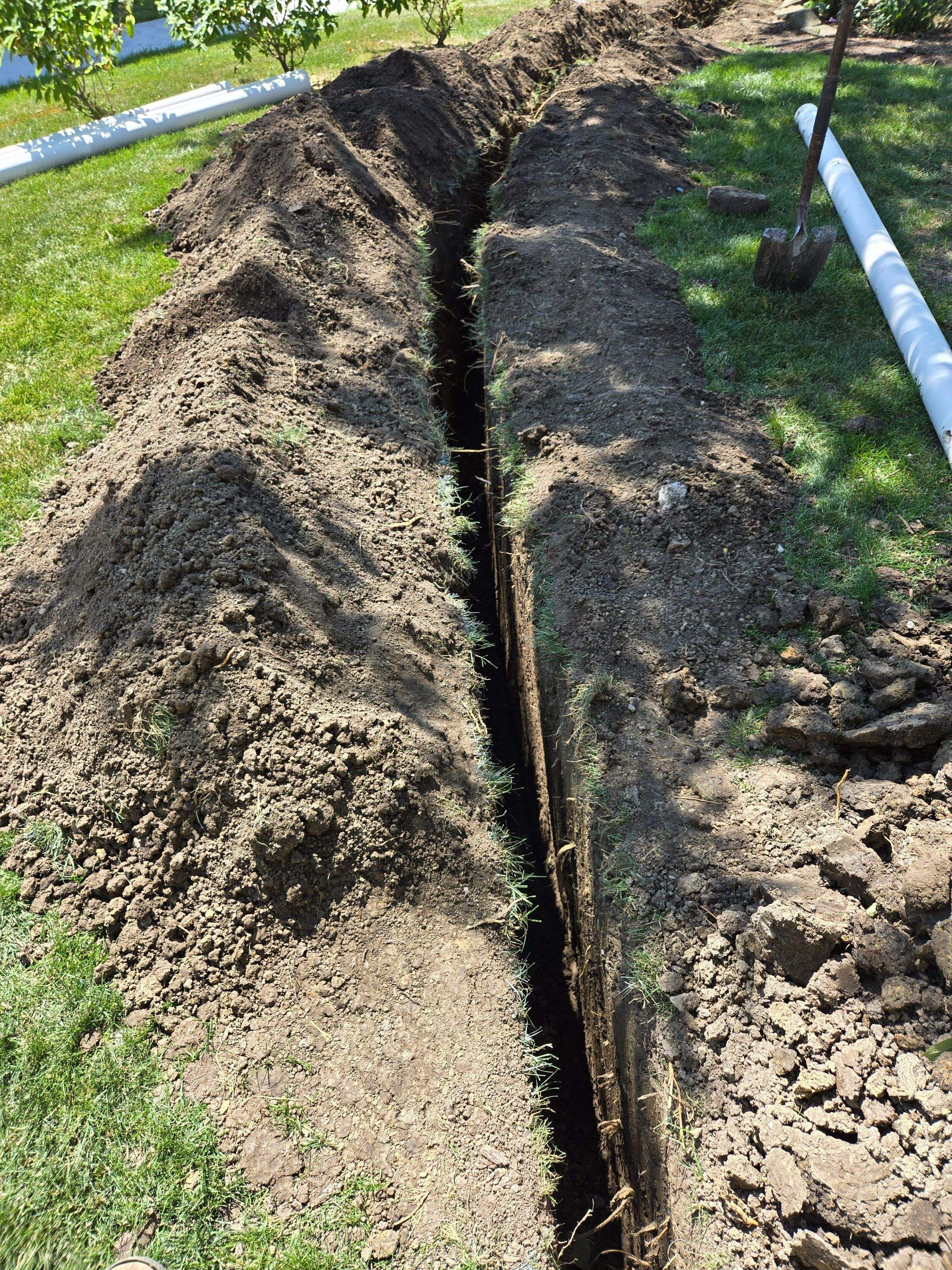Burial of Sump Pump and Down Spout Discharges and Partial Waterproofing of Wall by Allied Water Services