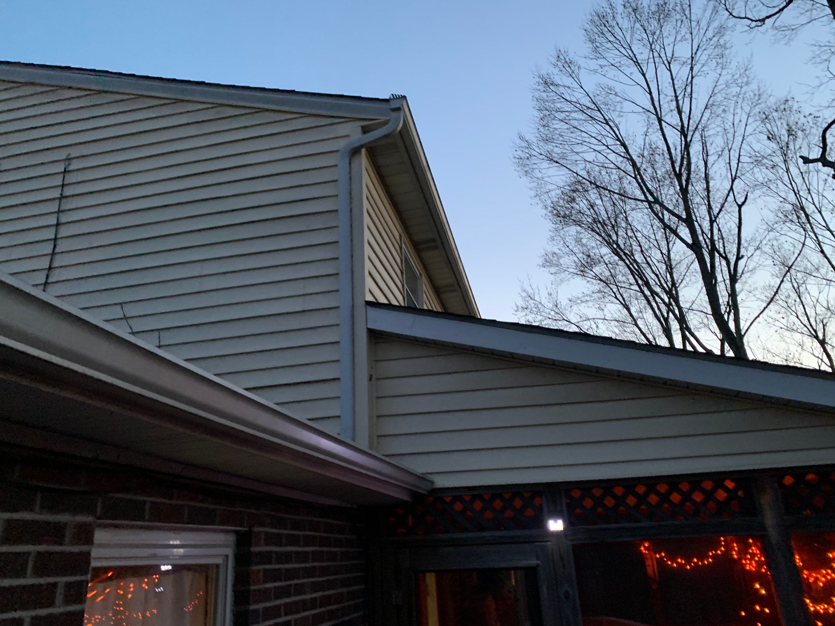 Replace dated vinyl siding with new white exterior Portfolio vinyl siding  by Secure Construction Company Inc