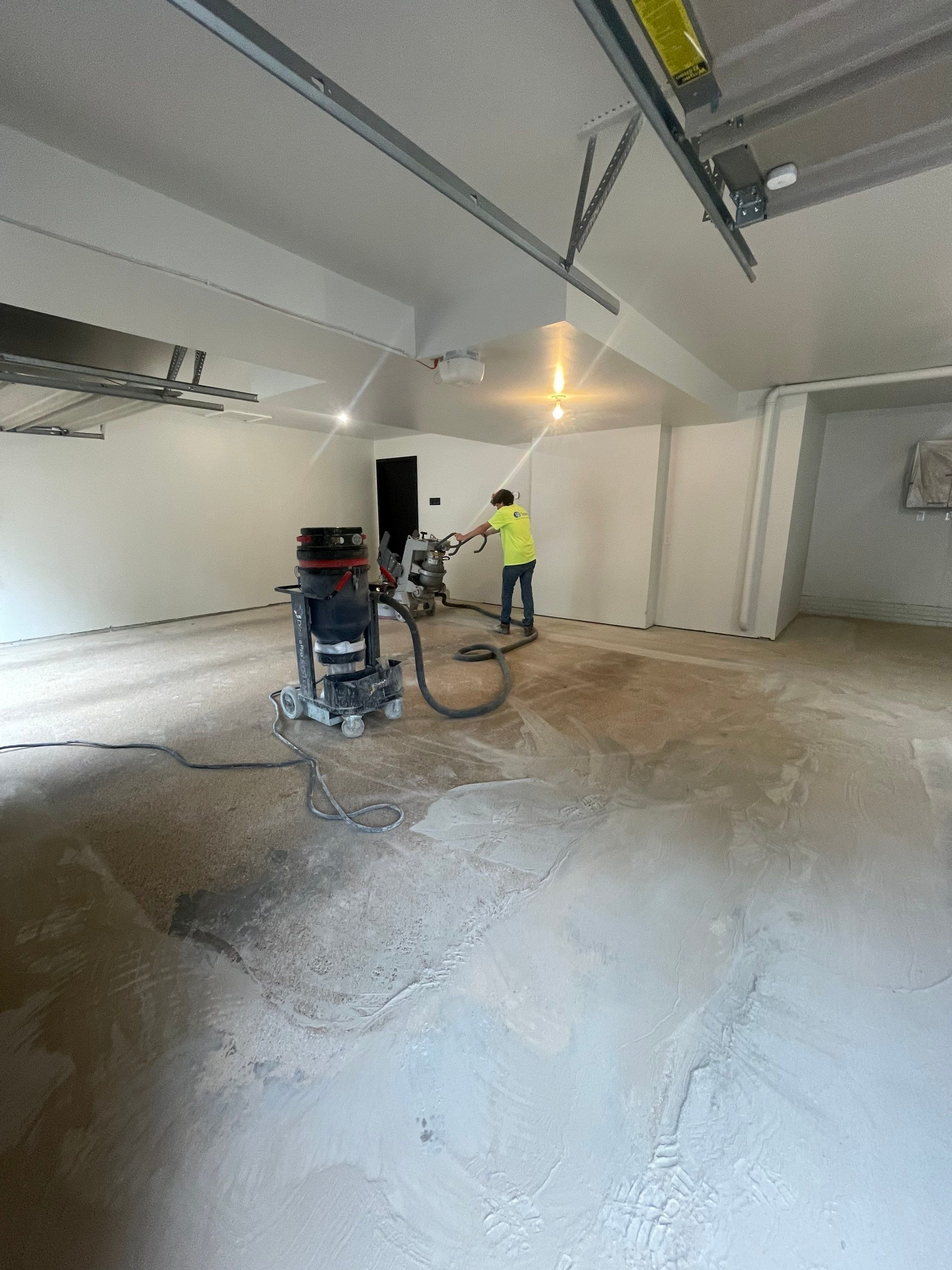 Gray Speckled Epoxy Garage Floor Coating in Sioux Falls by Select Painting, Coatings & Garage Cabinets