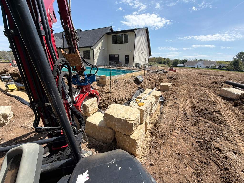 Limestone Boulder Wall by Sota landscaping