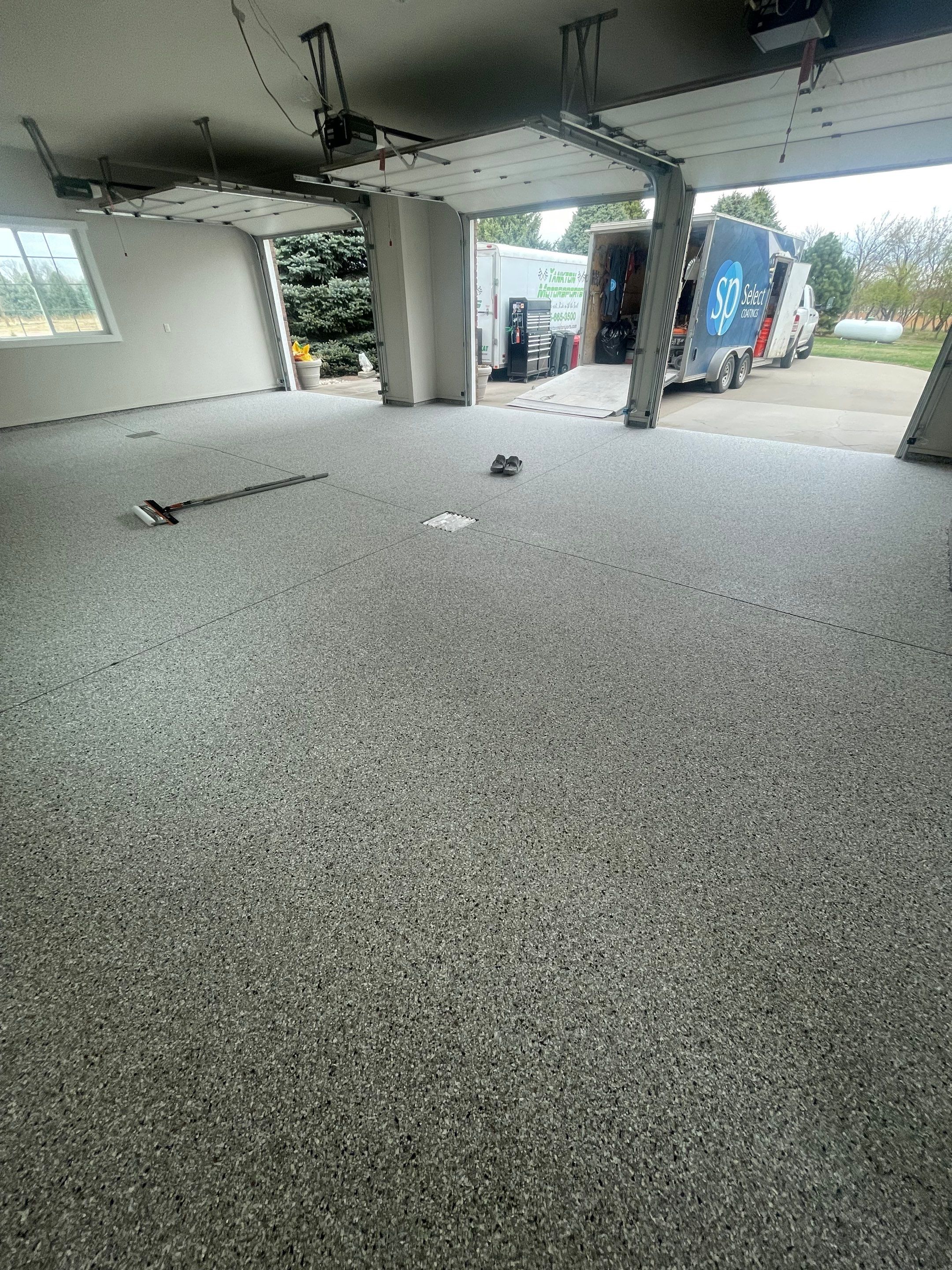 Garage transformation in Yankton by Select Painting, Coatings & Garage Cabinets