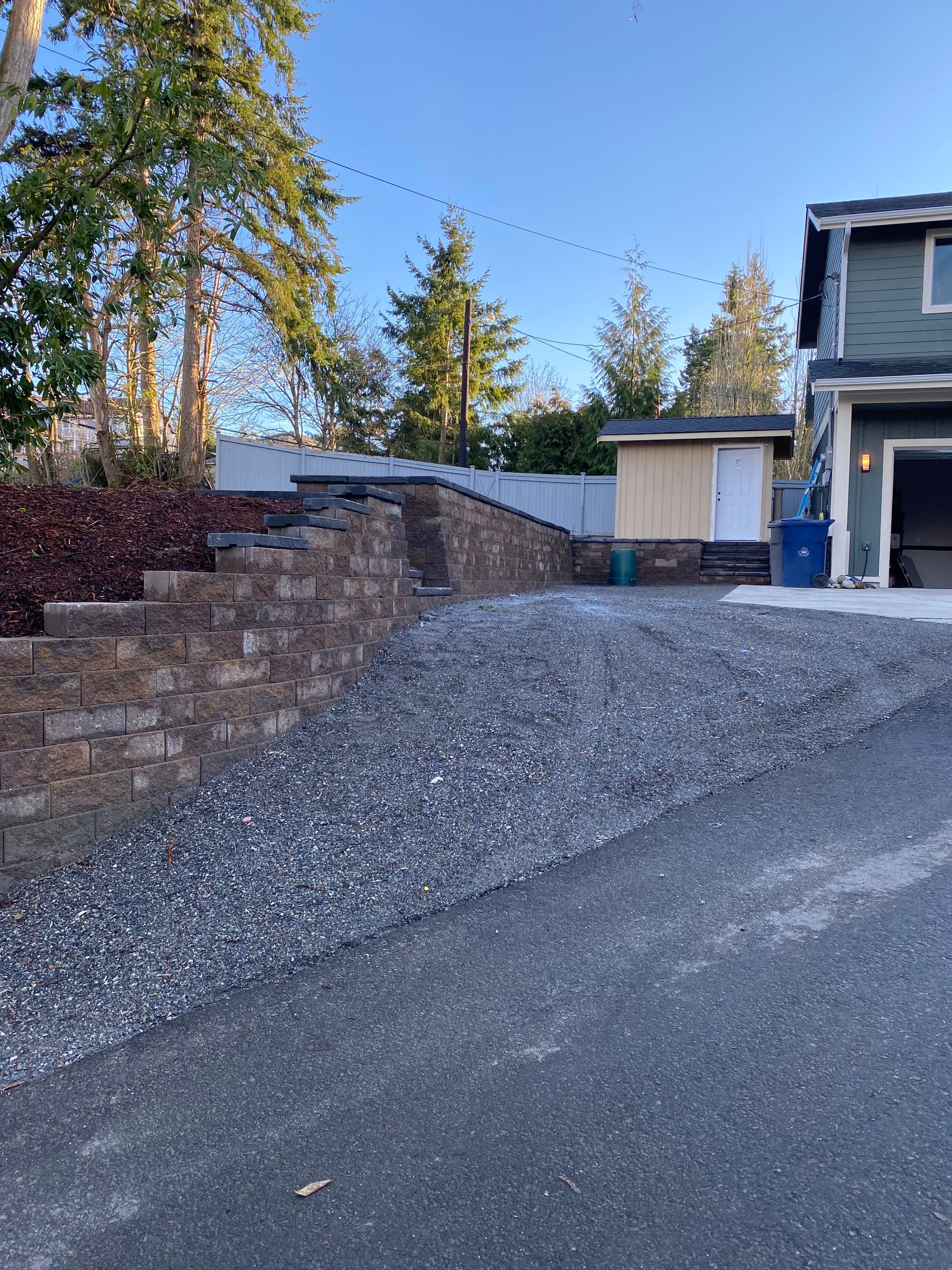 Patio Installation using Concrete, Retaining walls, and Turf install by Jireh Asphalt & Concrete Inc 