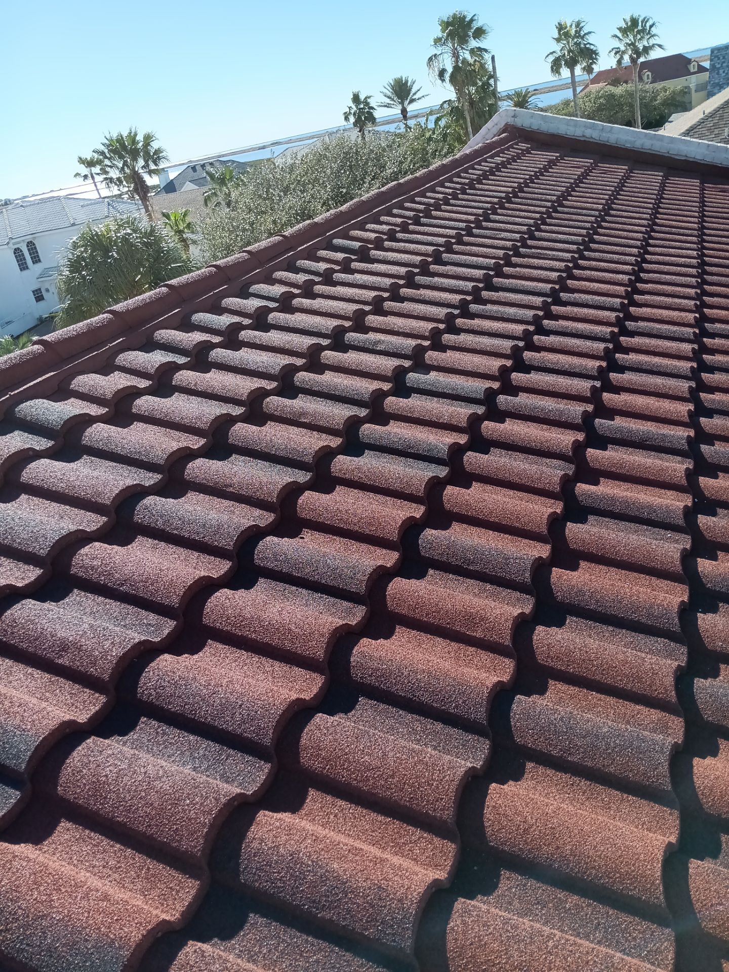 Off with the Tile and on with the TILCOR stone coated metal.  by Bayfront Roofing and Construction
