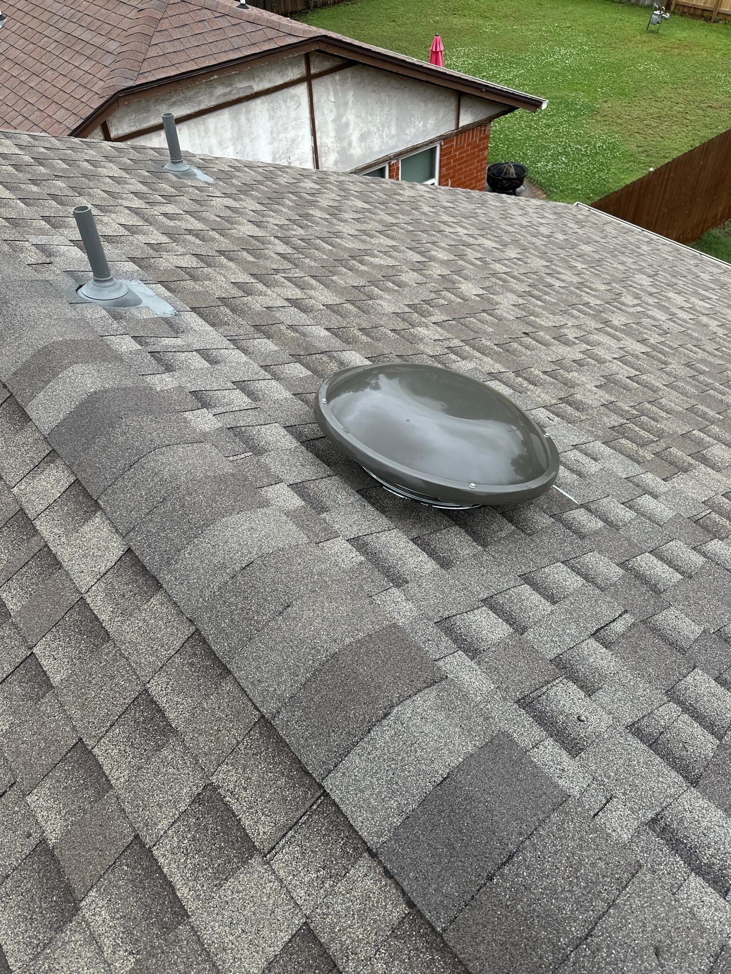 barn roof repair and solar tube replacement in Mustang by McCann's Roofing and Construction