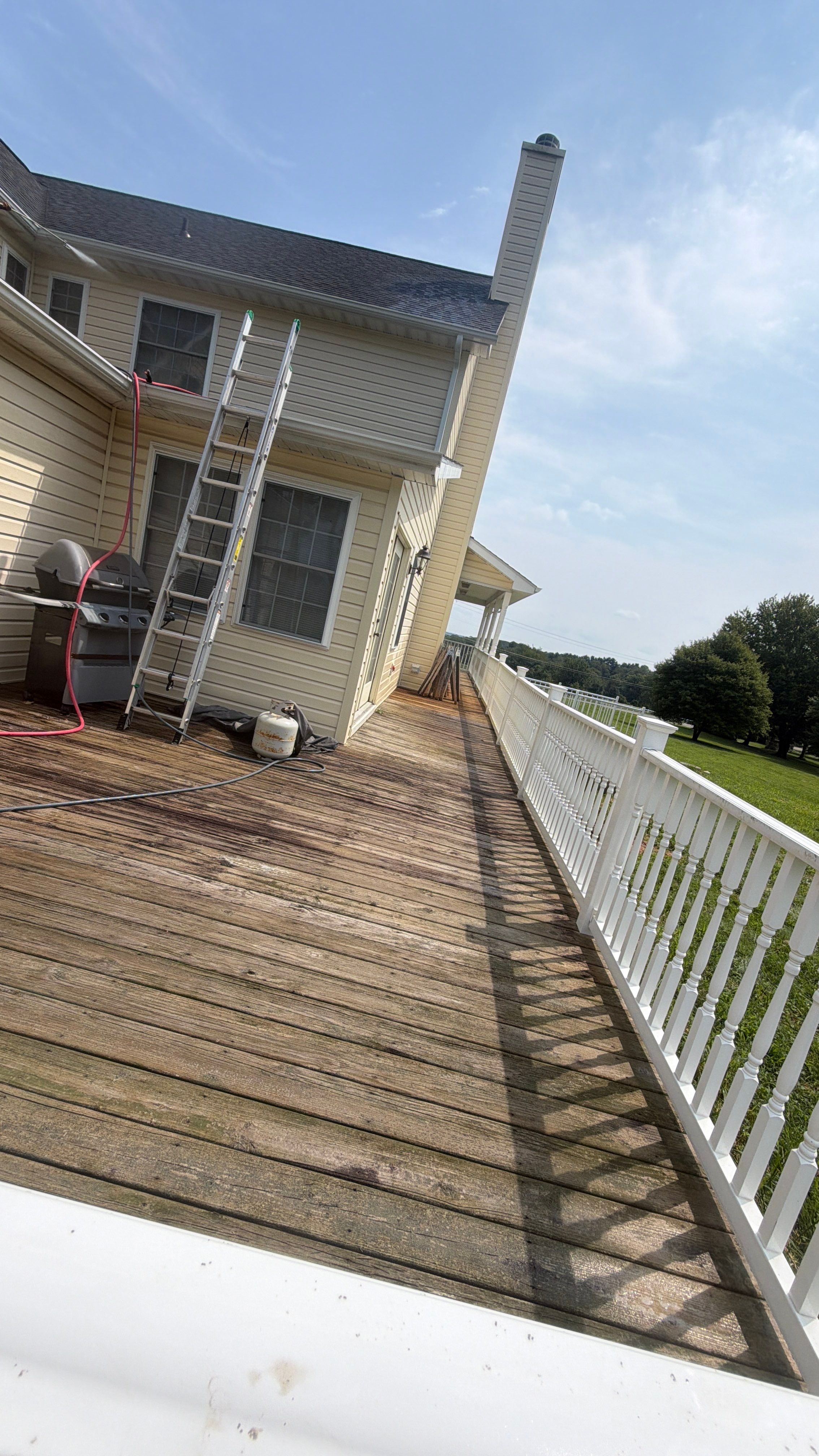 Vinyl Siding House Washing and Wood Deck Restoration in Carroll County by Baltimore Pressure Washers Inc.