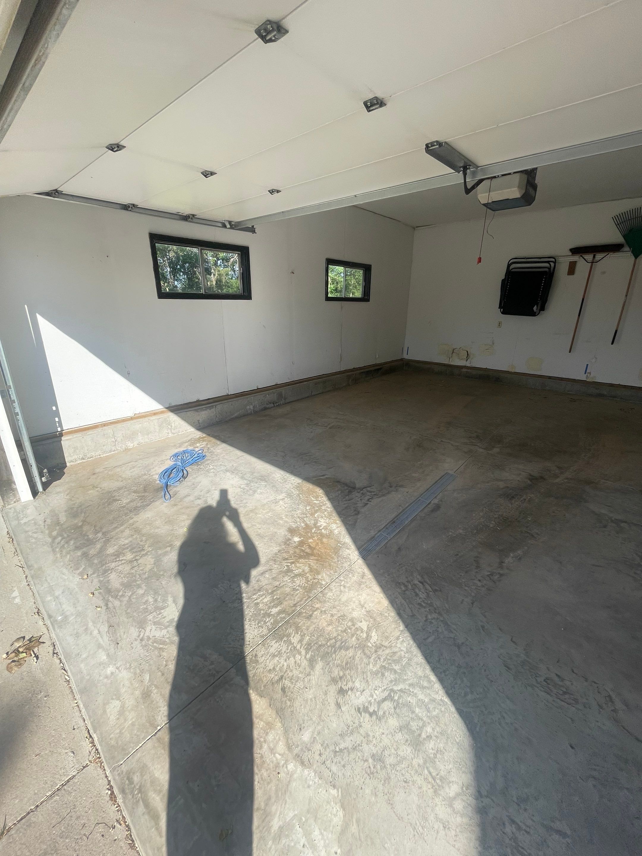 Hartford Residential Garage Floor Transformation With Decorative Chip Coating by Select Painting, Coatings & Garage Cabinets