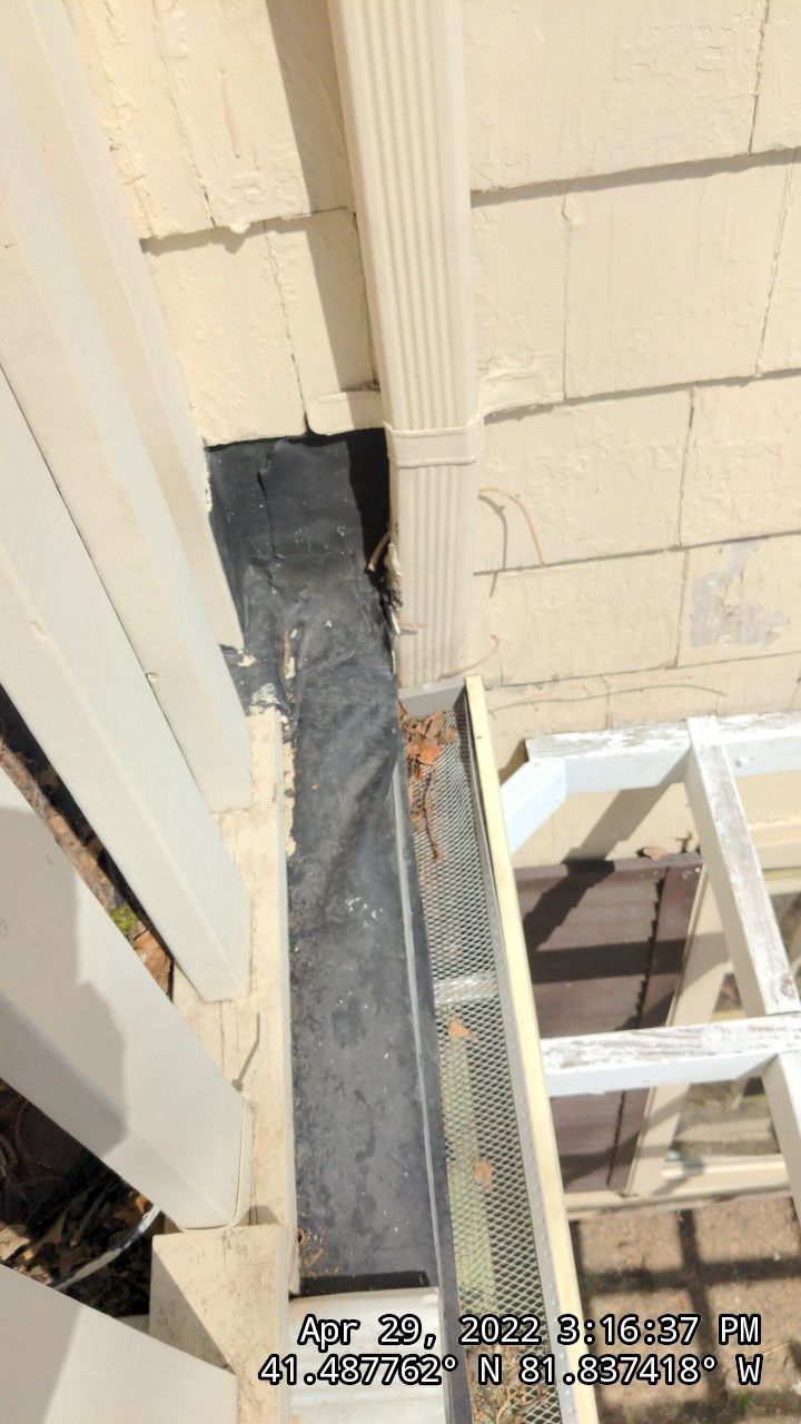 Residential Roofing Installation, Dec-tek walk-out porch roof, siding on garage by Absolute Roofing and Construction
