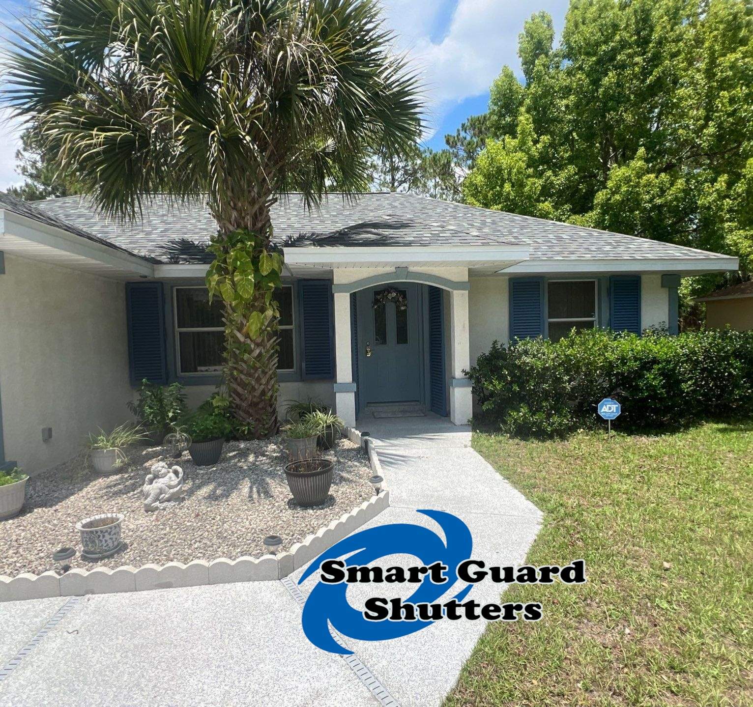 Impact Rated Colonial Shutters in Pigeon Blue by Smart Guard Shutters