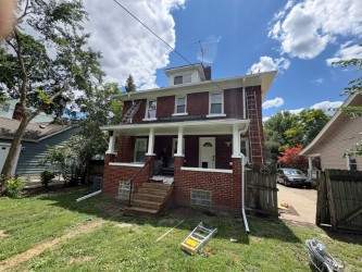 Ferndale Exterior Trim Restoration and Gutter System Installation by Top Shelf Painter