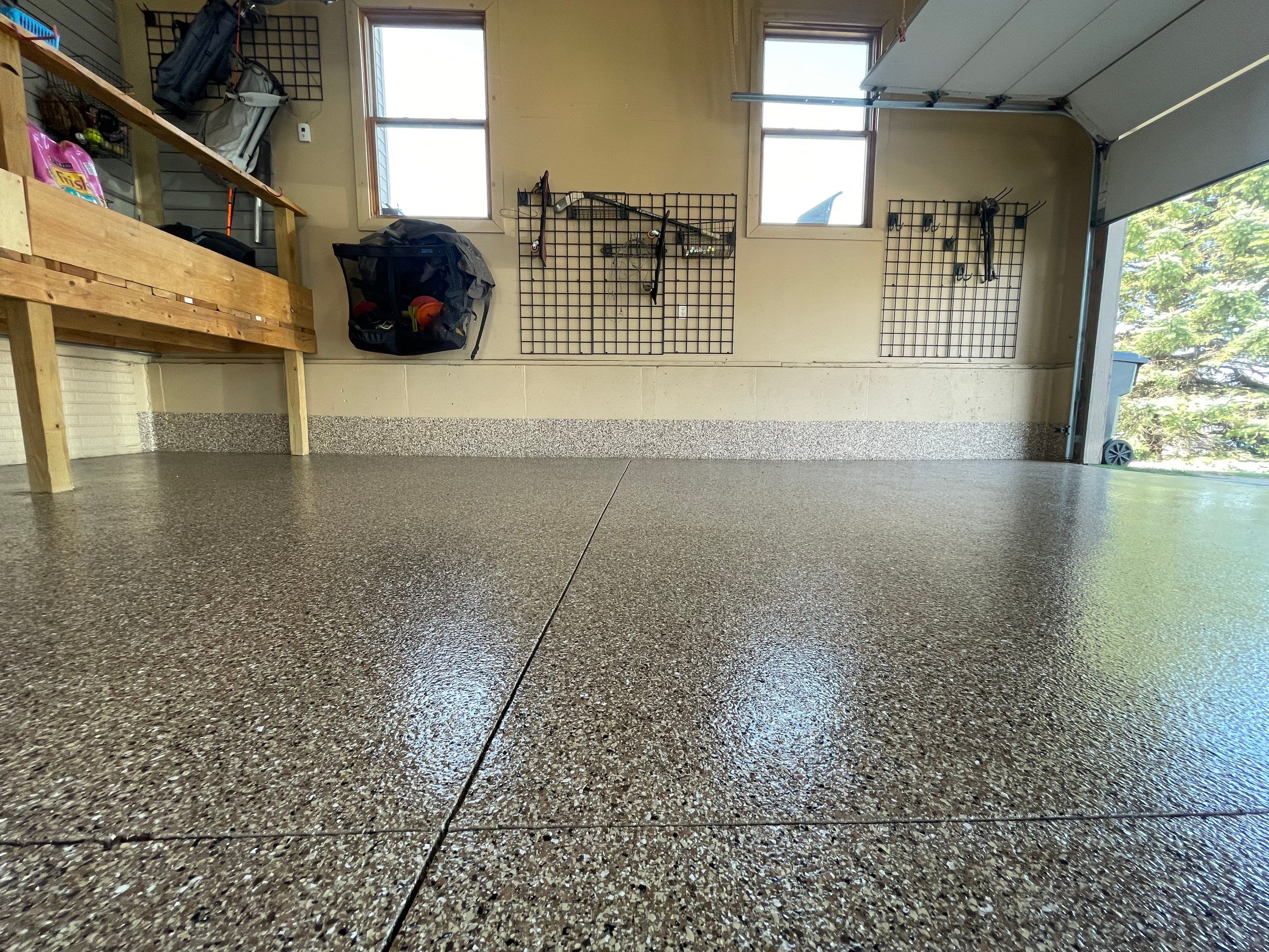 Residential Garage Floor Transformation with Speckled Epoxy Coating by Select Painting, Coatings & Garage Cabinets