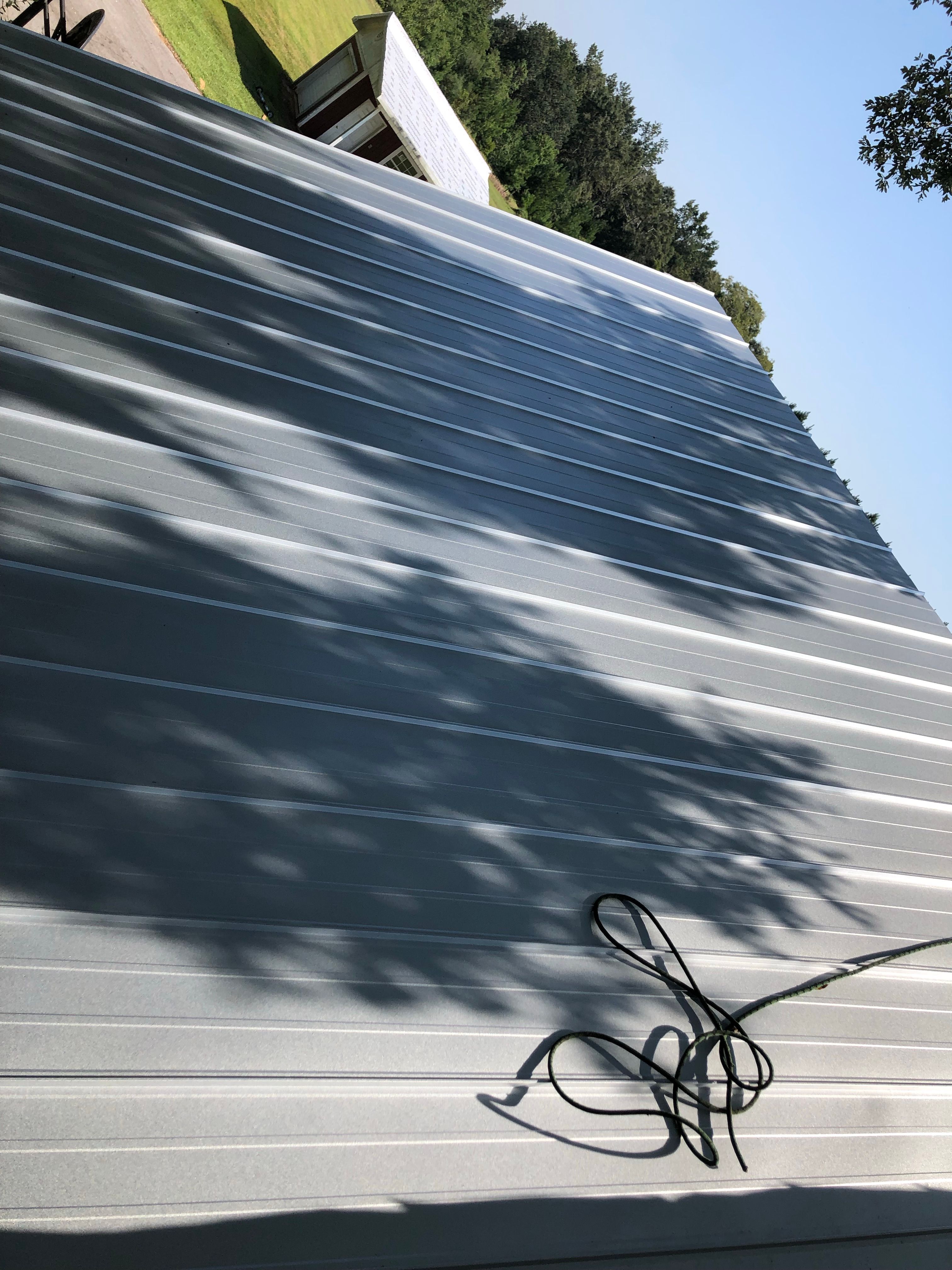 Residential Roofing Installation using Metal roofing by American Roofing & Construction LLC