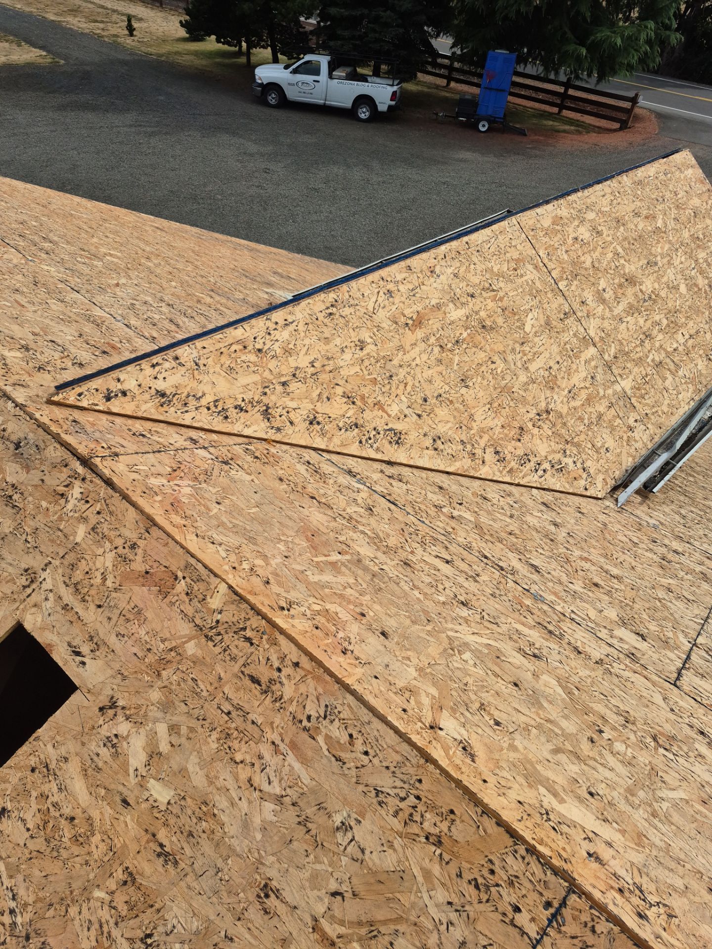 Residential Roof Replacement with Metal Accents by Orezona Building & Roofing Company, Inc.