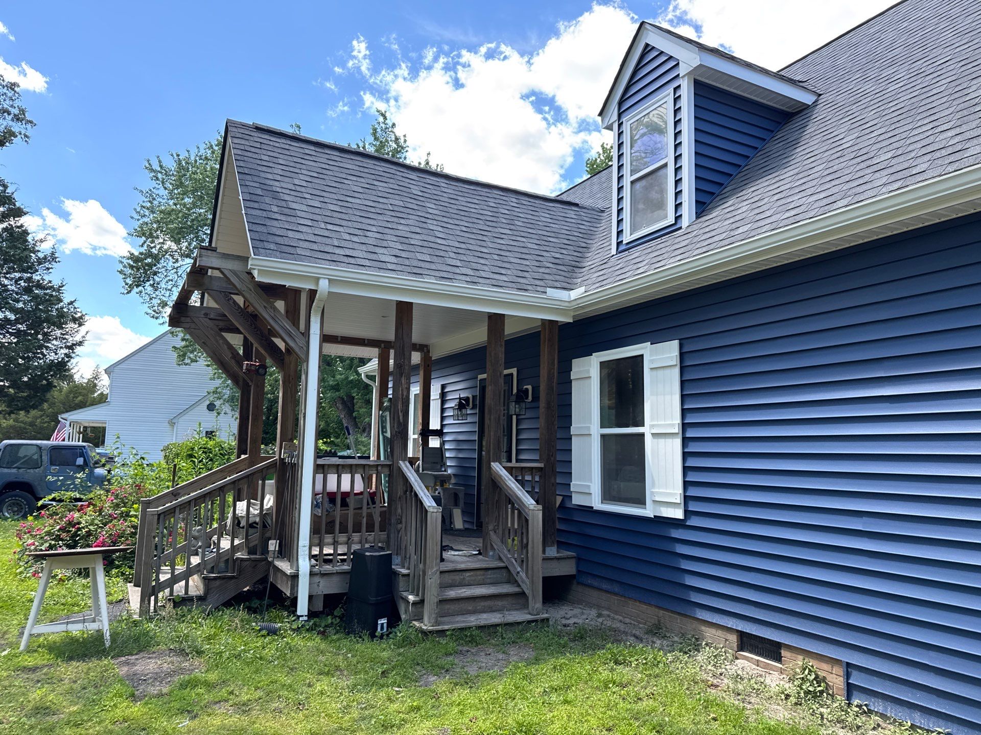 Gloucester Exterior Overhaul with Navy Blue Siding and New Roof by Cade Construction