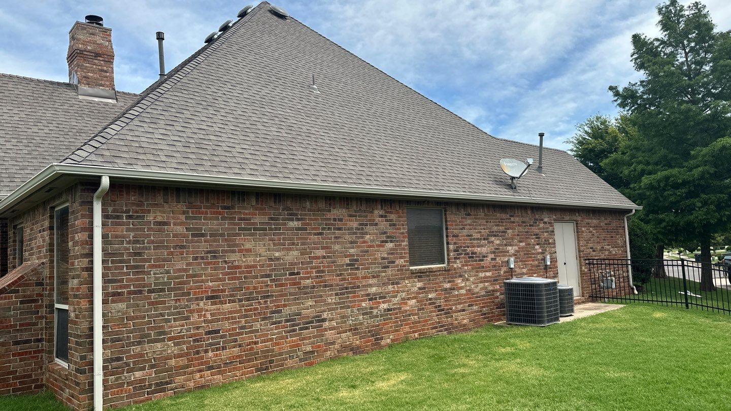 Roof Replacement and Gutter Installation in Edmond, OK by McCann's Roofing and Construction
