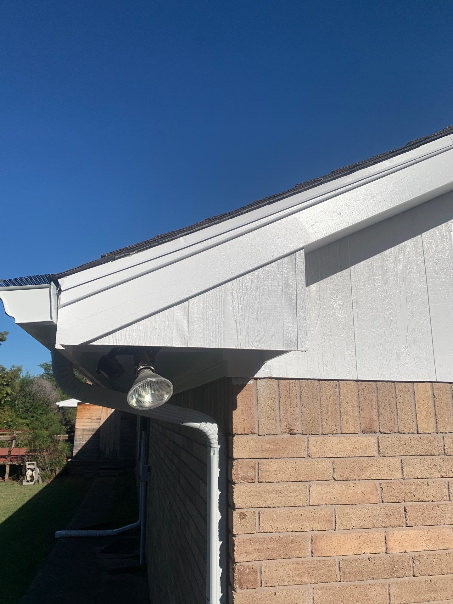 gutter install & soffit repair & exterior paiting in Oklahoma City by McCann's Roofing and Construction