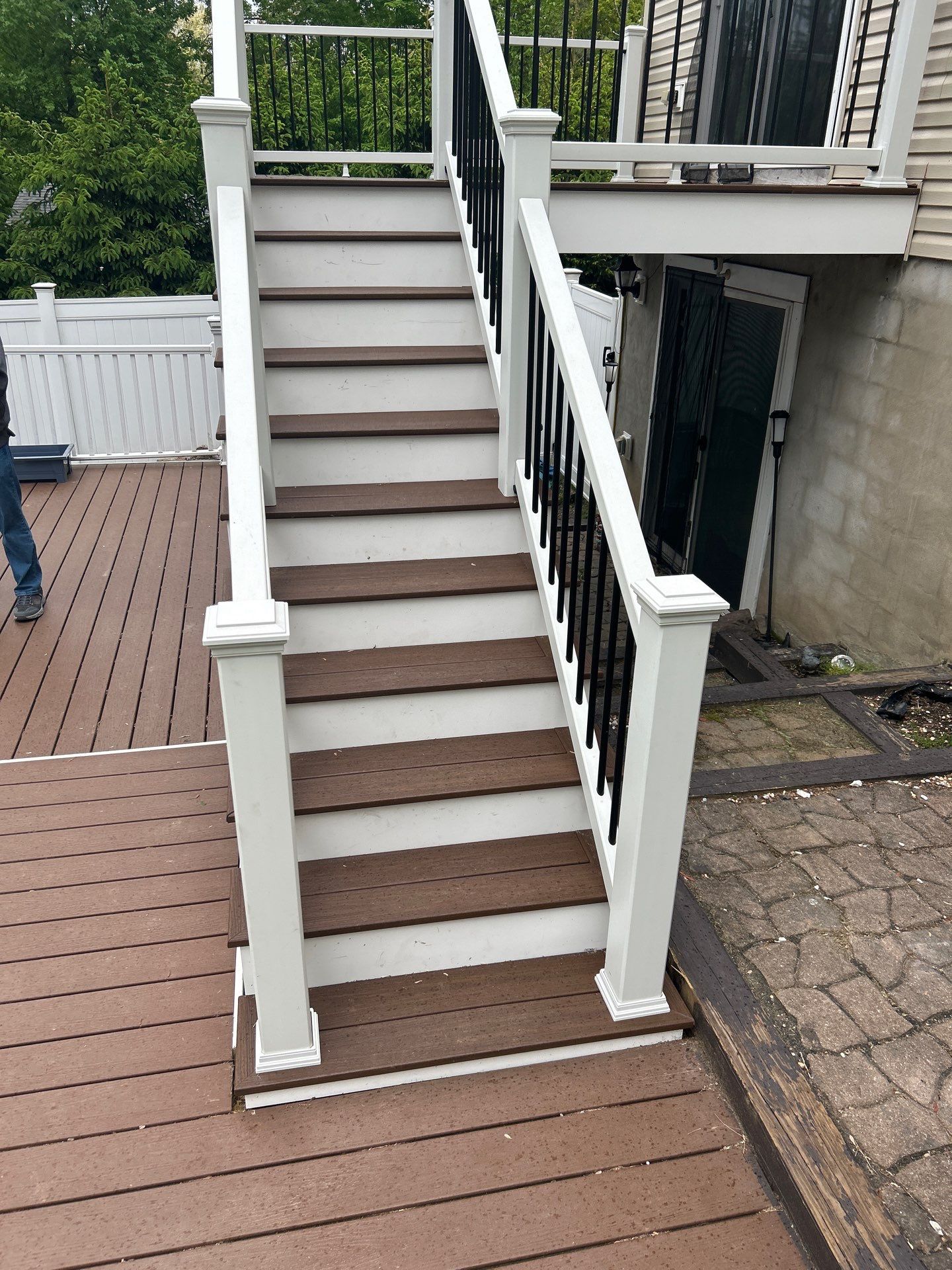 Elevated Composite Deck Replacement with White Railing in Tannersville by Herts Roofing & Construction