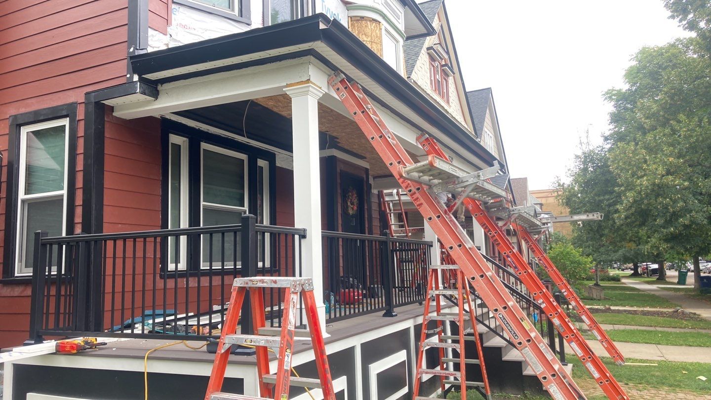 Exterior Renovations- Siding, Stamped Concrete, Porch, and Railings by Ivy Lea Construction