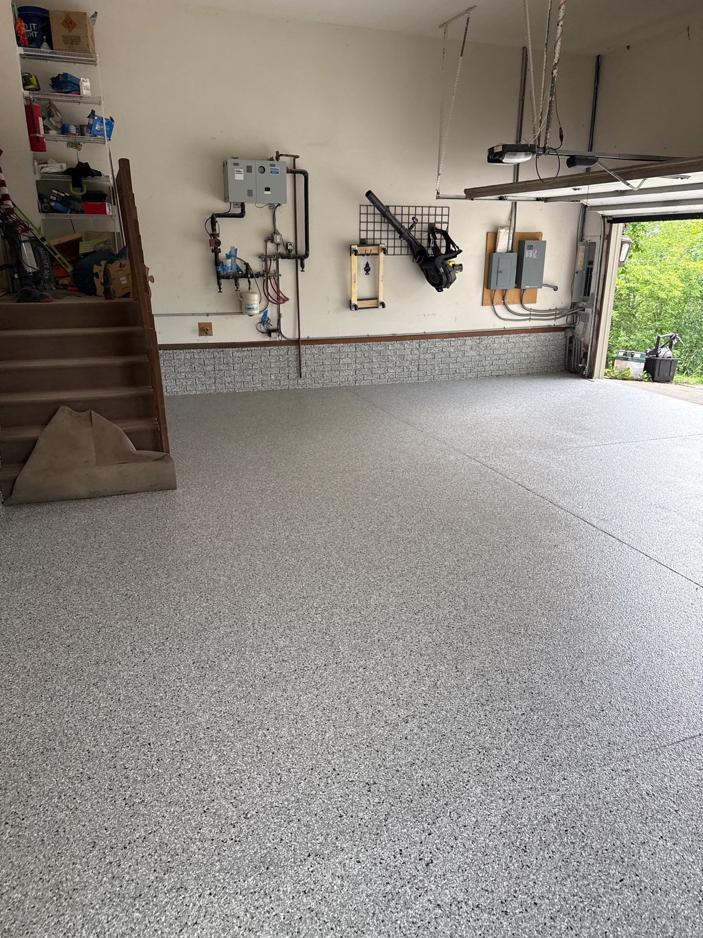 Coyote Flake Epoxy Garage Floor Coating in Earlham by Revival Concrete Coatings