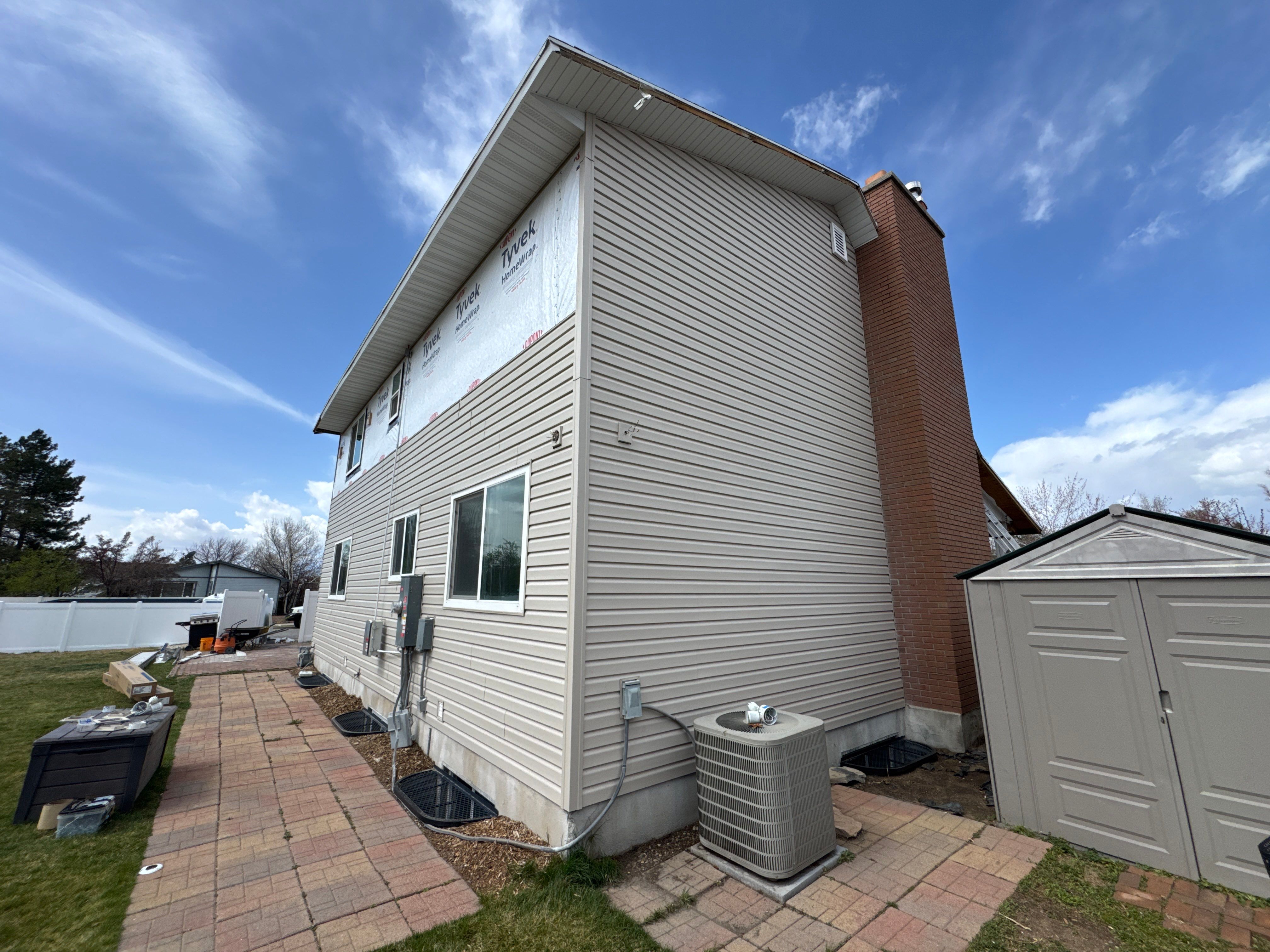 Sandy | Strategic Hardie & Vinyl Integration | Cobble Stone & Desert Sand by Ideal Siding Utah