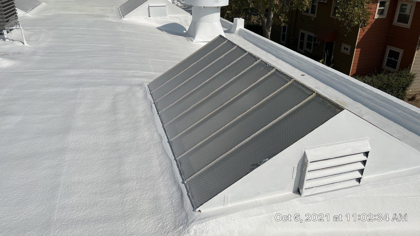 Polyurethane foam roof refurbish and recoating by Straight Edge Roofing Inc