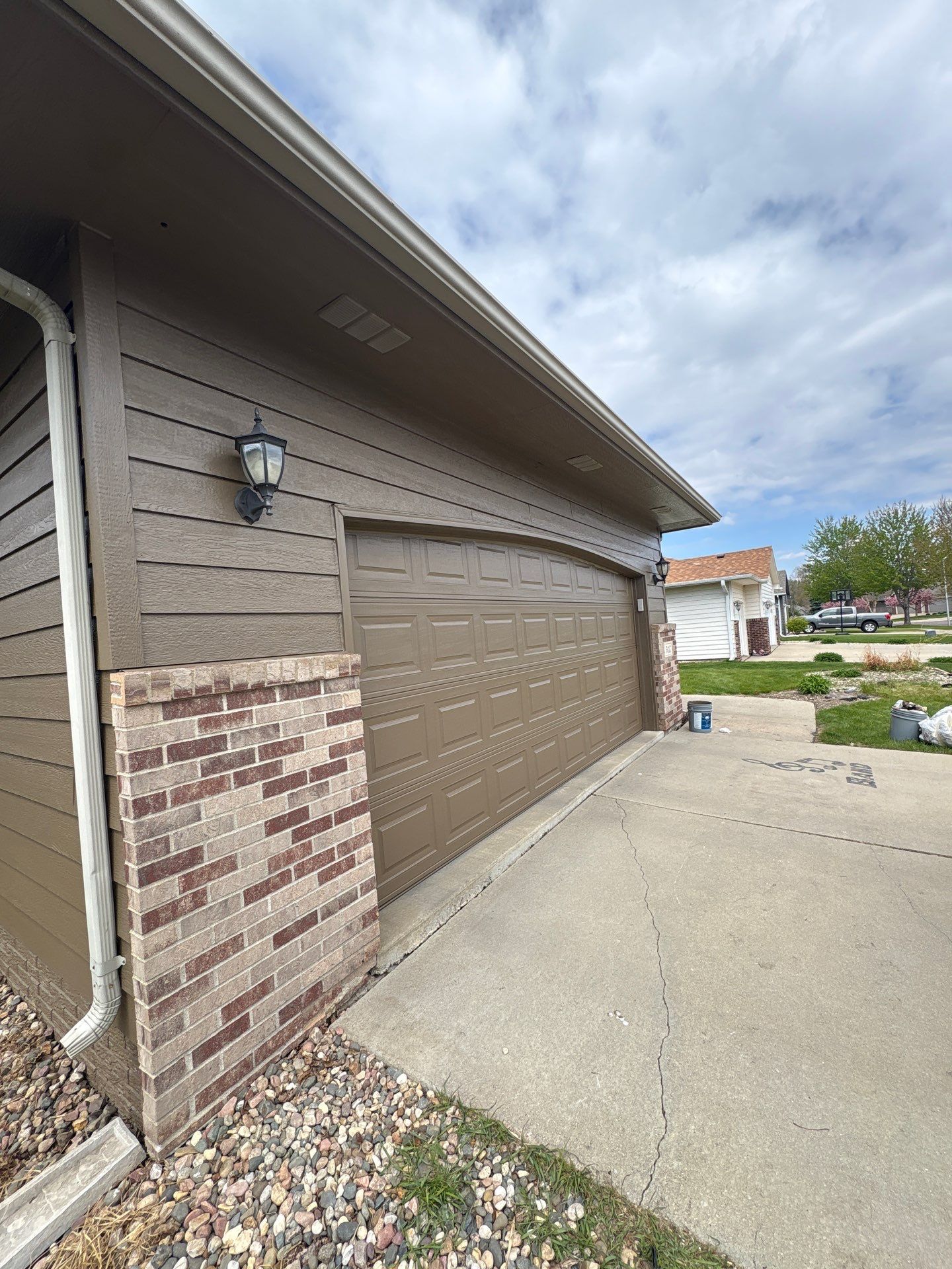Exterior Painting and Wood Trim Replacement in Sioux Falls by Select Painting, Coatings & Garage Cabinets