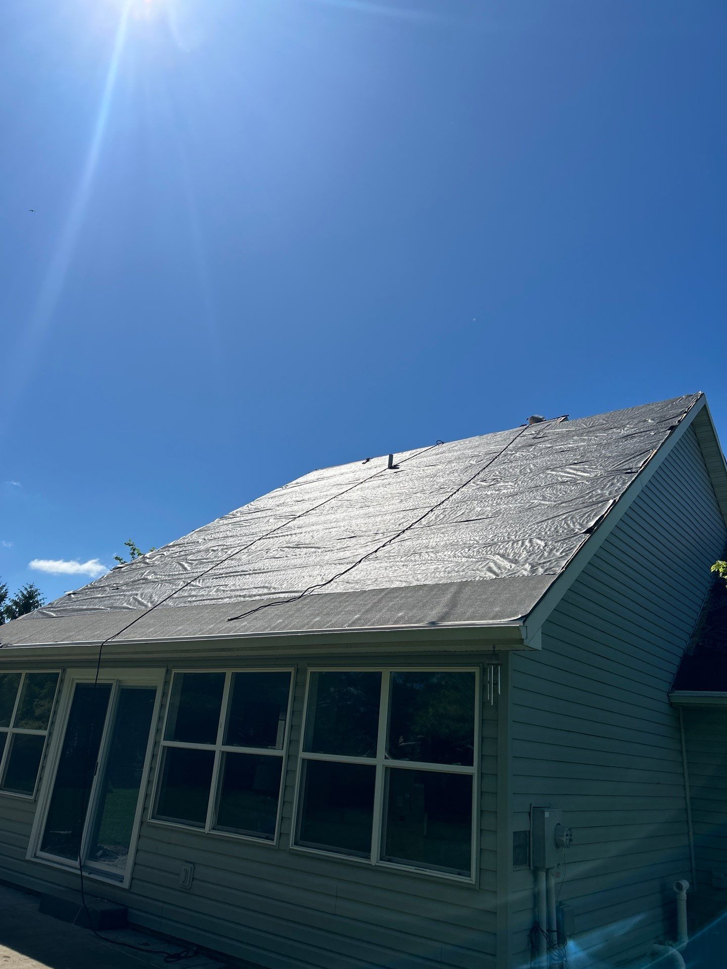 Exterior Installation using Onyx Black Durations and White Siding by WIW Enterprises Inc