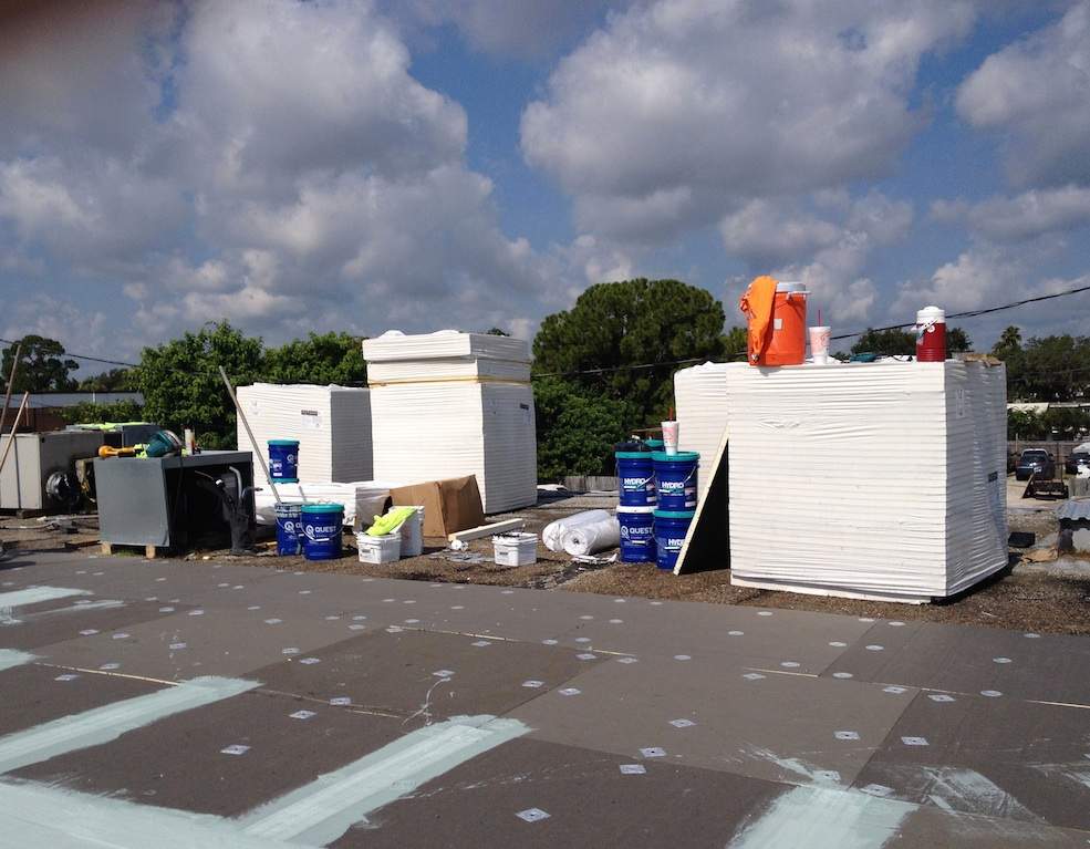 White Reflective Commercial Roof Coating Installation in Melbourne FL by Florida Roofing and Renovations Inc.