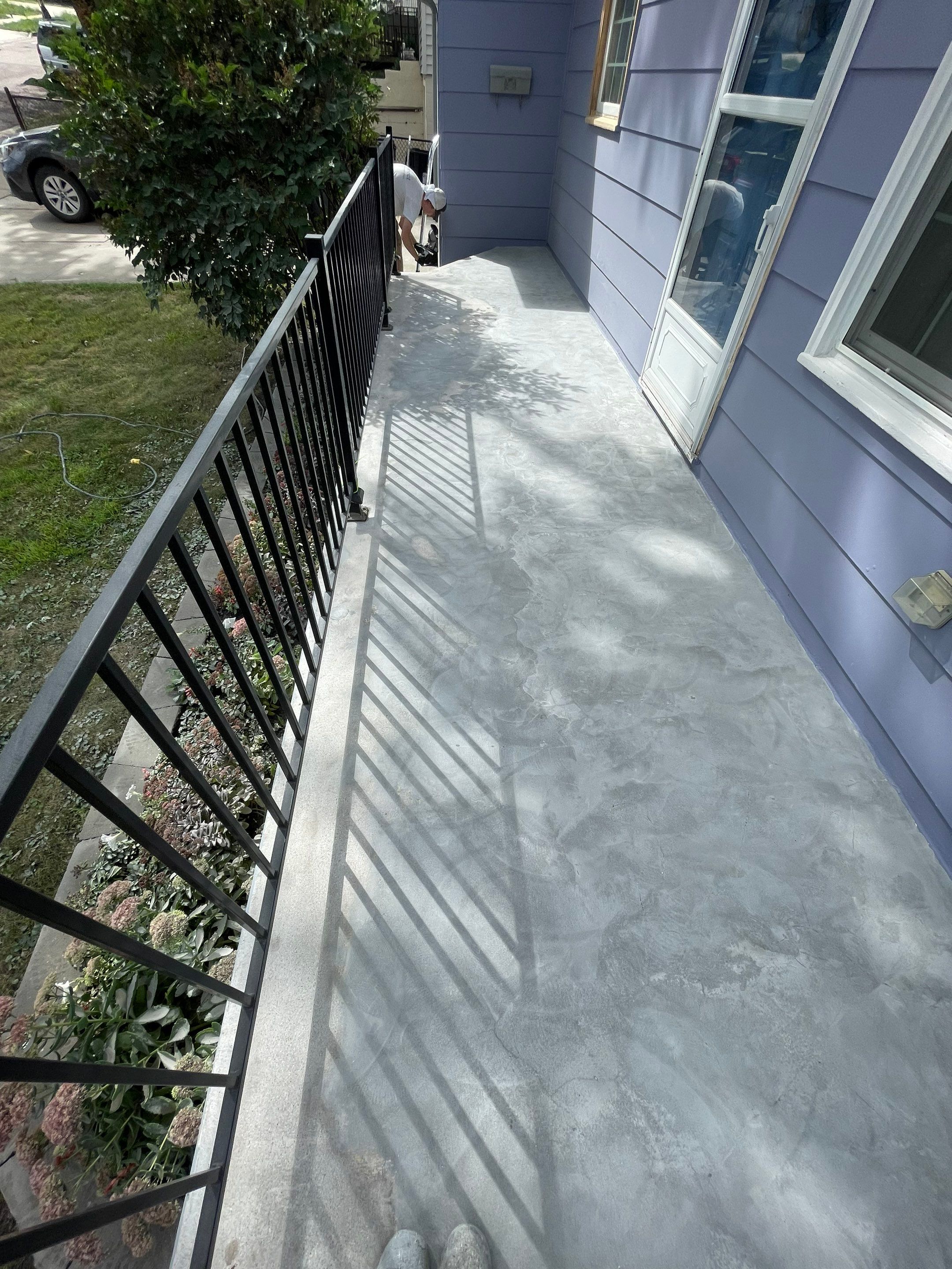 Sioux Falls Concrete Porch Coating with Starry Evening Finish by Select Painting, Coatings & Garage Cabinets