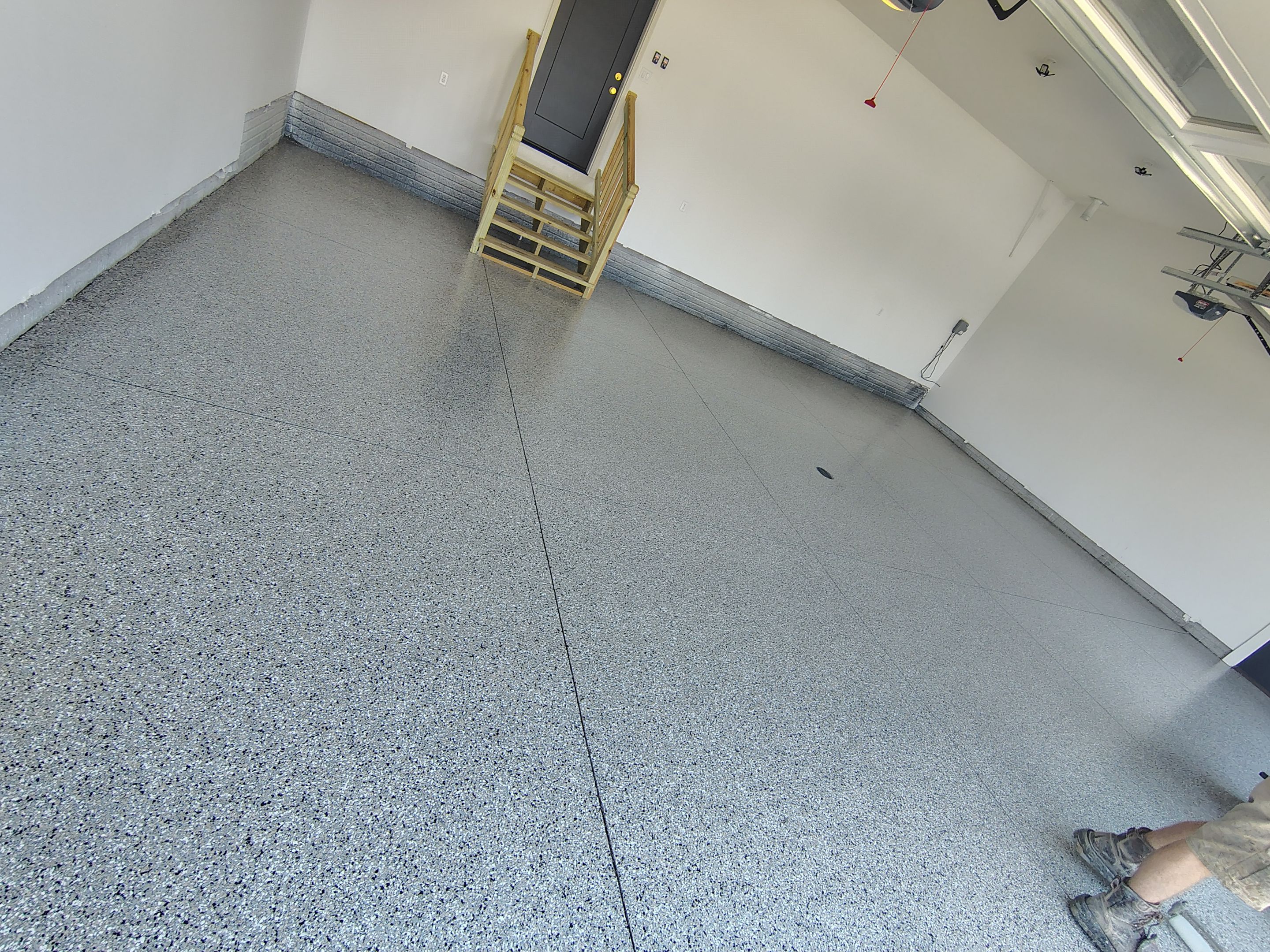 Cabin Fever Decorative Flake Garage Floor Coating in Sioux Falls by Select Painting, Coatings & Garage Cabinets
